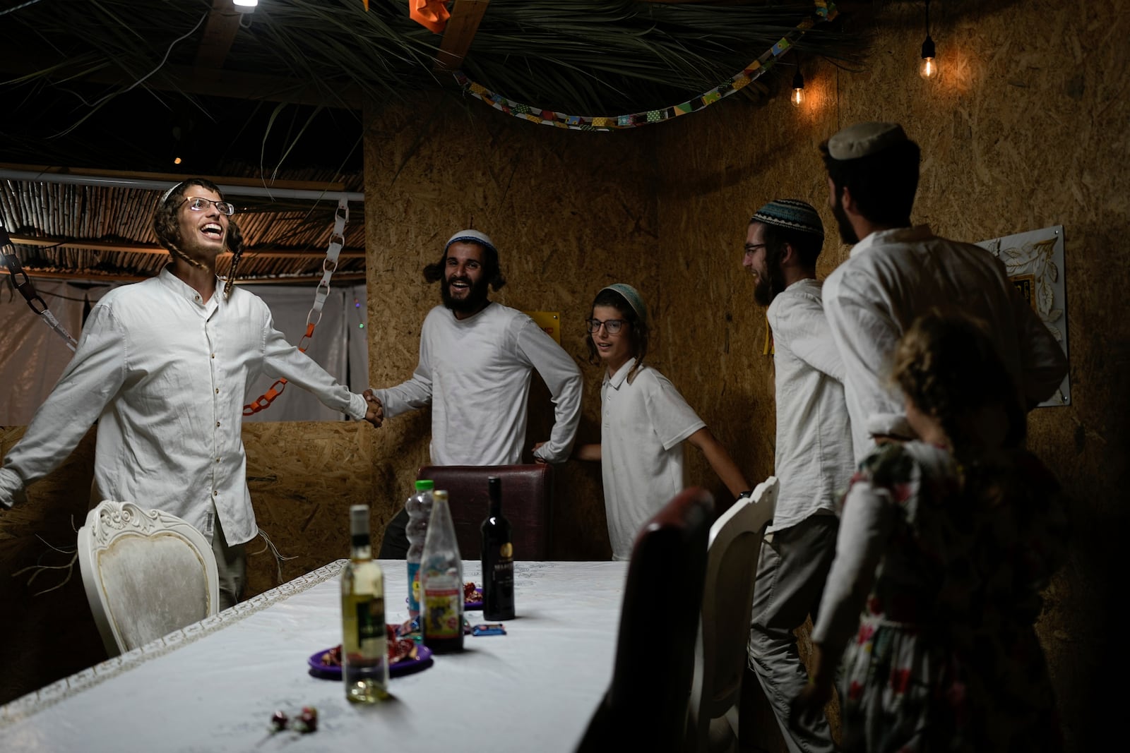 Israelis celebrate the news of the death of Hamas leader Yahya Sinwar, near Kibbutz Erez, southern Israel, on Thursday, Oct. 17, 2024, (AP Photo/Tsafrir Abayov)