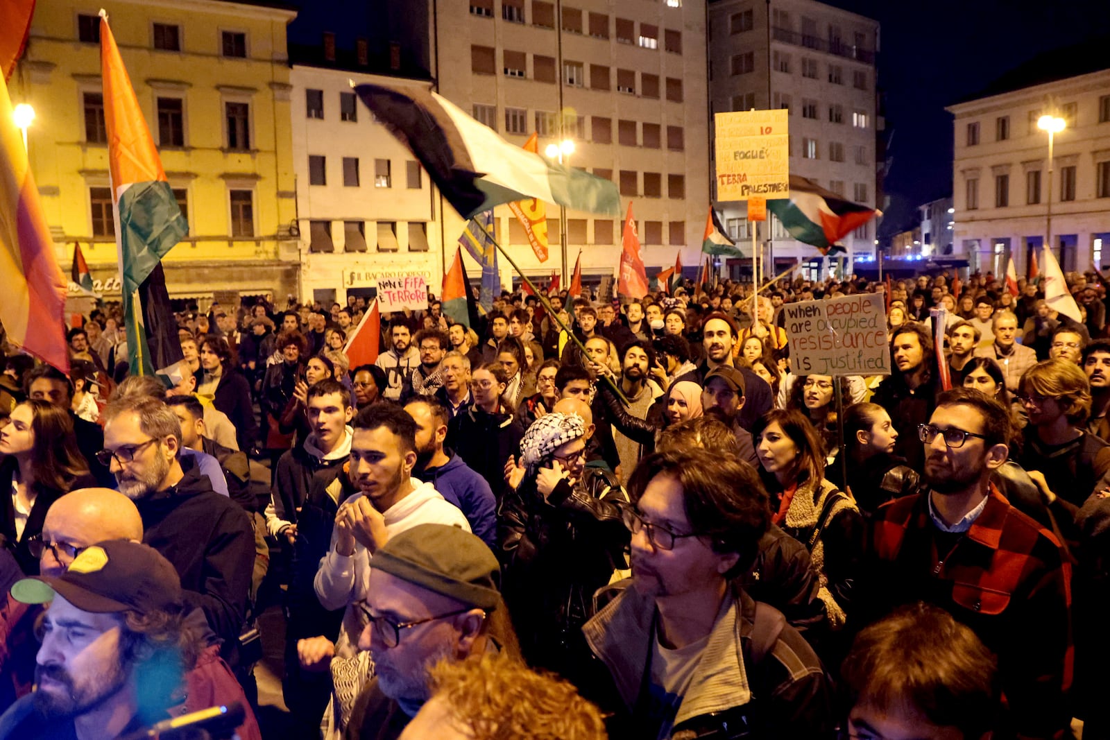 People march during a pro-Palestinians protest ahead of the Nations League soccer match between Italy and Israel, in Udine, Italy, Monday, Oct. 14, 2024. (Riccardo Modena/LaPresse via AP)