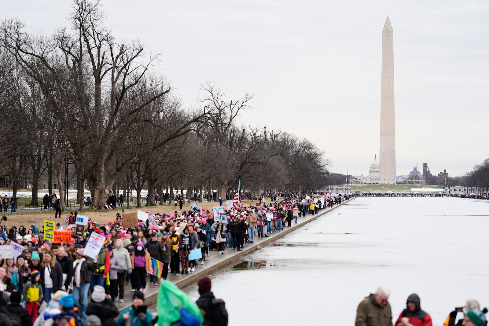 People march toward the Lincoln Memorial during the People's March, Saturday, Jan. 18, 2025, in Washington. (AP Photo/Mike Stewart)