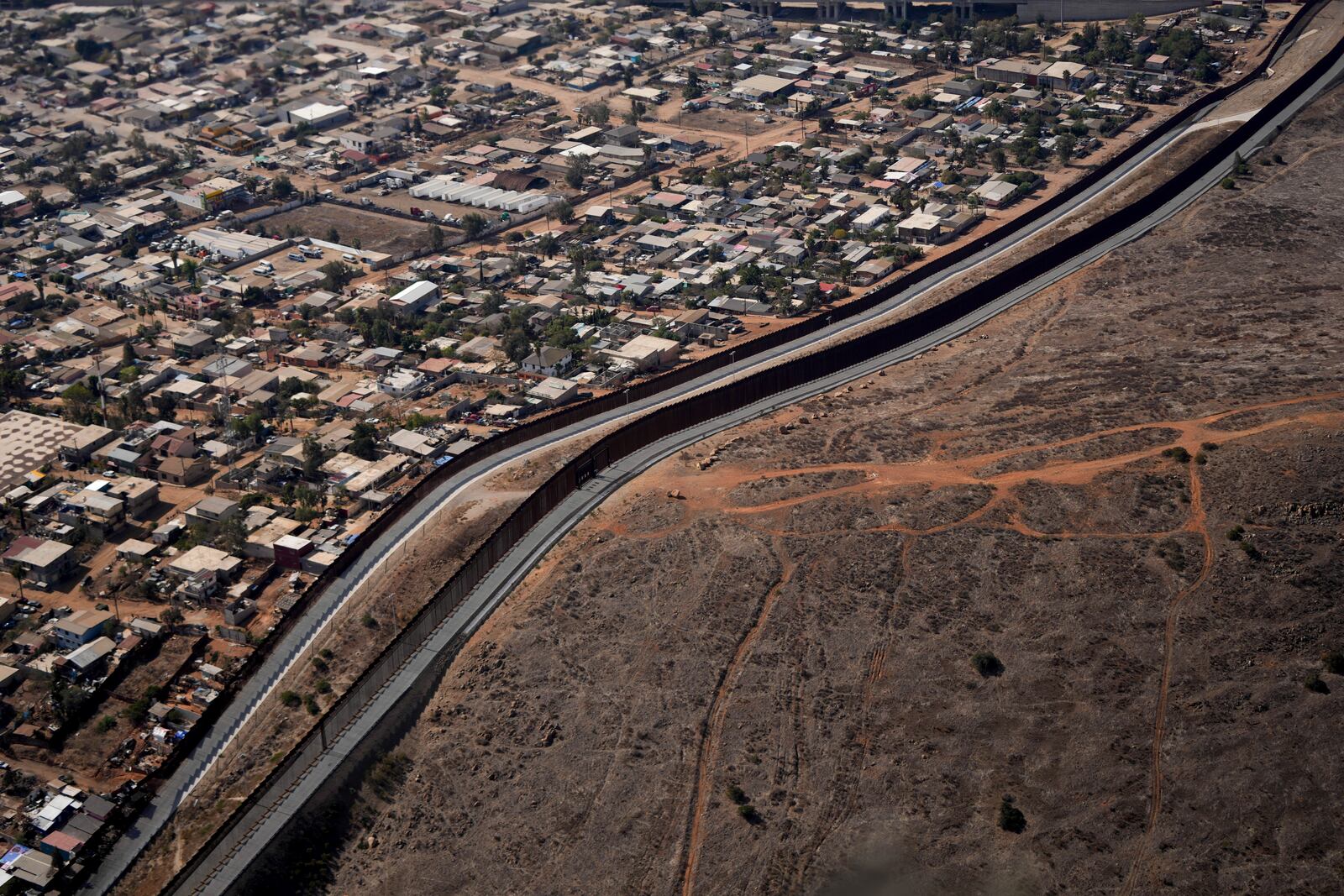 The U.S. Border with Mexico is seen in an aerial view Friday, Jan. 31, 2025, near San Diego. (AP Photo/Jae C. Hong)