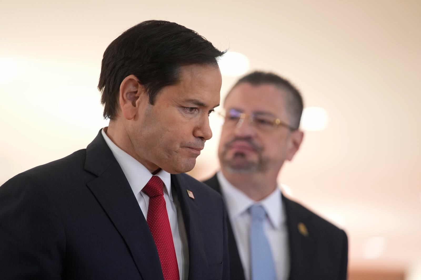 U.S. Secretary of State Marco Rubio, front, and Costa Rican President Rodrigo Chaves leave after giving a joint news conference at the presidential palace in San Jose, Costa Rica, Tuesday, Feb. 4, 2025. (AP Photo/Mark Schiefelbein, Pool)