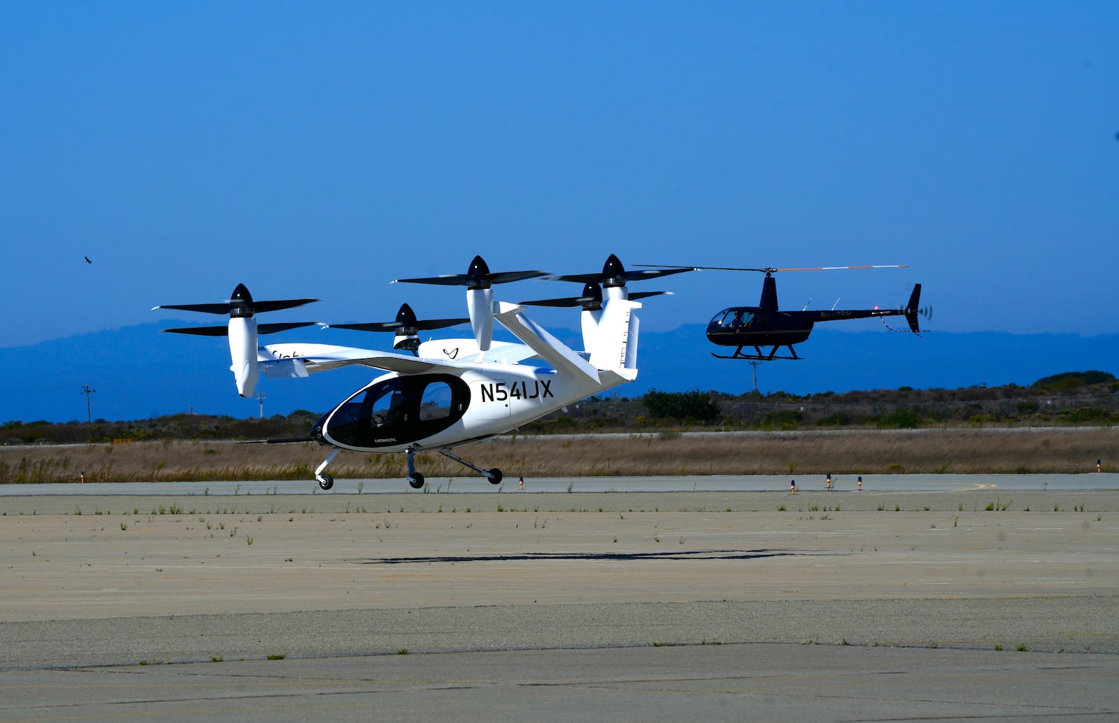 An "electric vertical take-off and landing" aircraft built by Joby Aviation lands at an airfield in Marina, Calif. on Monday, Oct. 7, 2024. (AP Photo/Terry Chea)