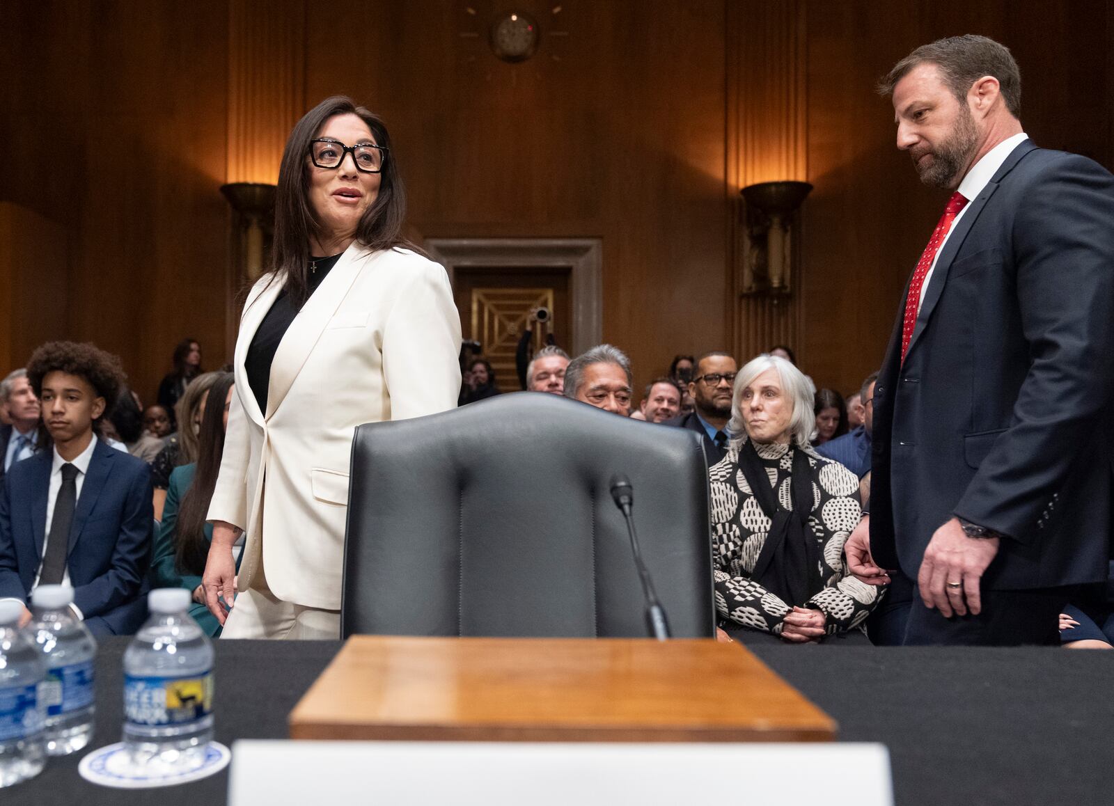 Lori Chavez-DeRemer, left arrives with Sen. Markwayne Mullin, R-Okla., for a hearing of the Senate Health, Education, Labor, and Pensions Committee on her nomination for Secretary of Labor, Wednesday, Feb. 19, 2025, on Capitol Hill in Washington. (AP Photo/Jacquelyn Martin)