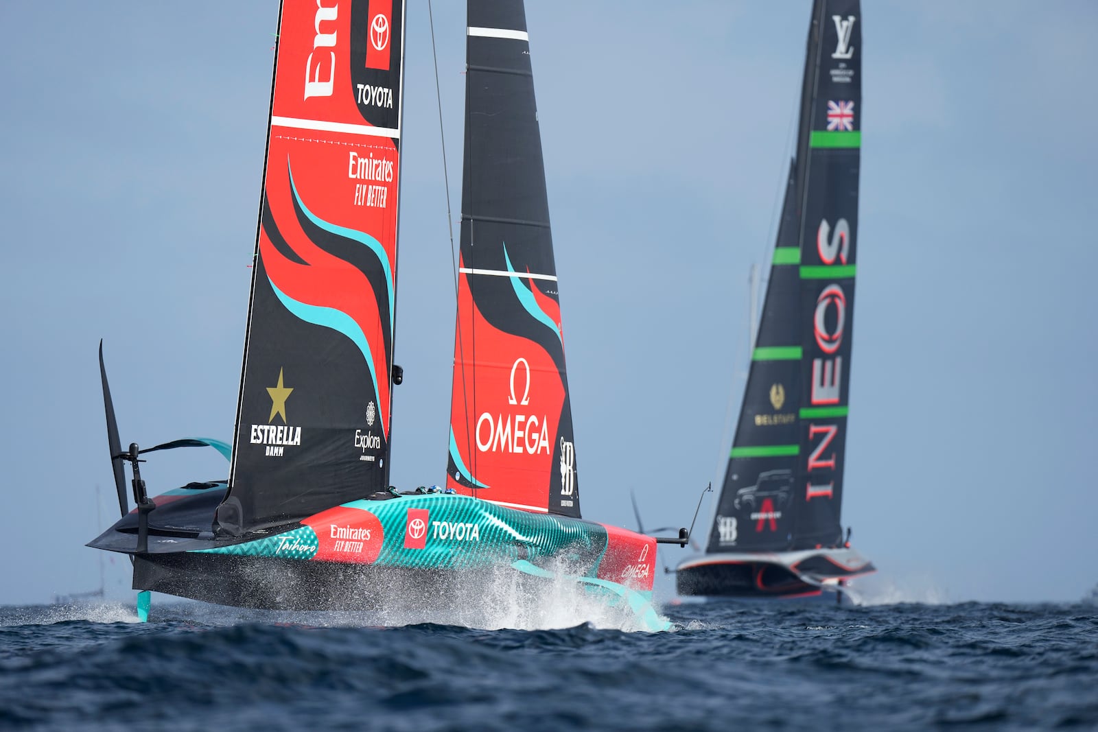 Ineos Britannia and Emirates Team New Zealand race during the Louis Vuitton 37th America's Cup Day 2 race in Barcelona, Spain, Sunday, Oct. 13, 2024. (AP Photo/Bernat Armangue)