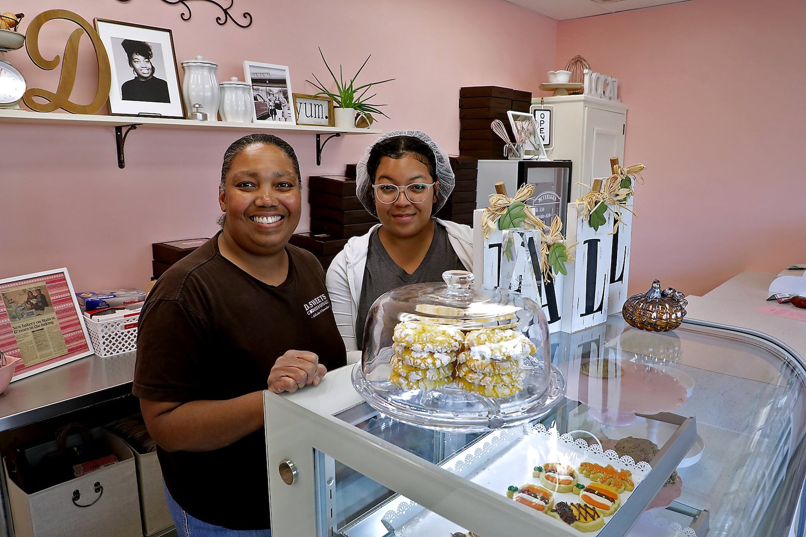 Donyale and Lailah Hill stand behind the counter at D Sweets Cookies and Gifts, 1605 E. Main St. on its first anniversary. BILL LACKEY/STAFF