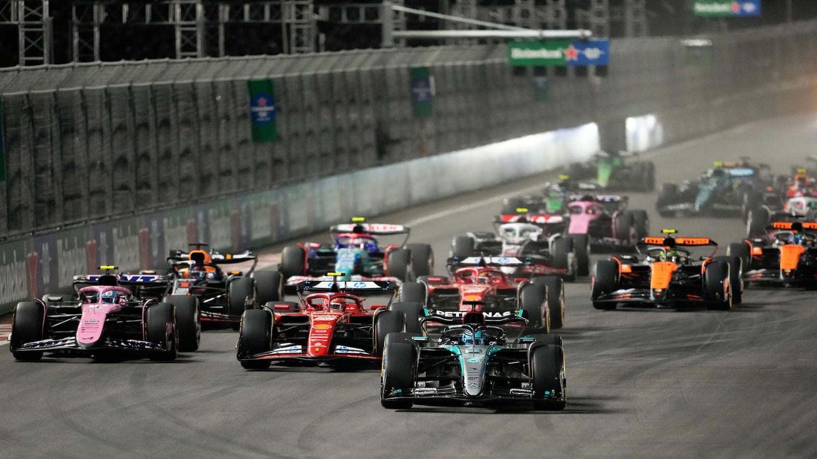 The field crowds together at the start of the F1 Las Vegas Grand Prix auto race, Sunday, Nov. 24, 2024, in Las Vegas. (AP Photo/Matt York)