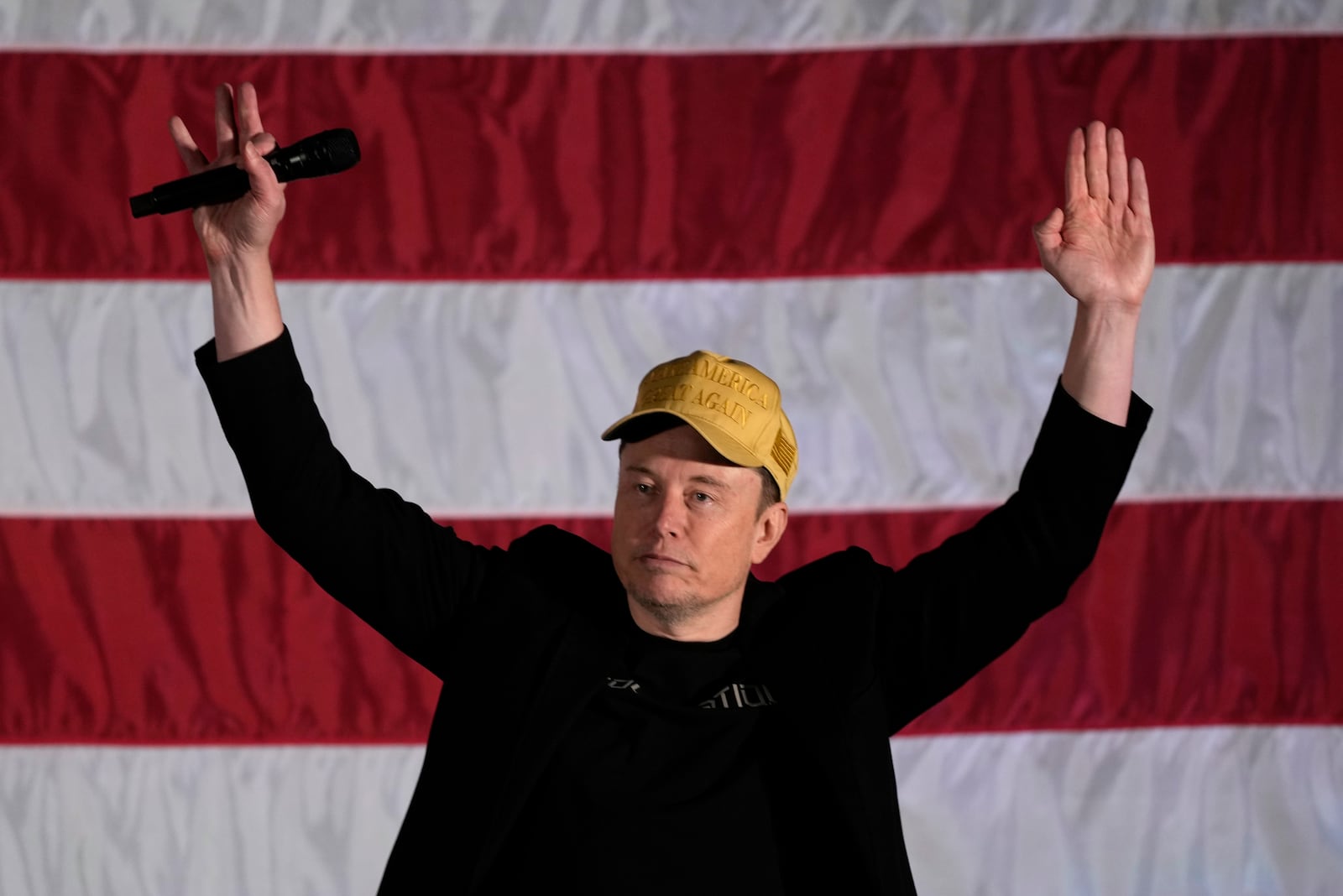 Elon Musk speaks as part of a campaign town hall in support of Republican presidential nominee former President Donald Trump in Folsom, Pa., Thursday, Oct. 17, 2024. (AP Photo/Matt Rourke)