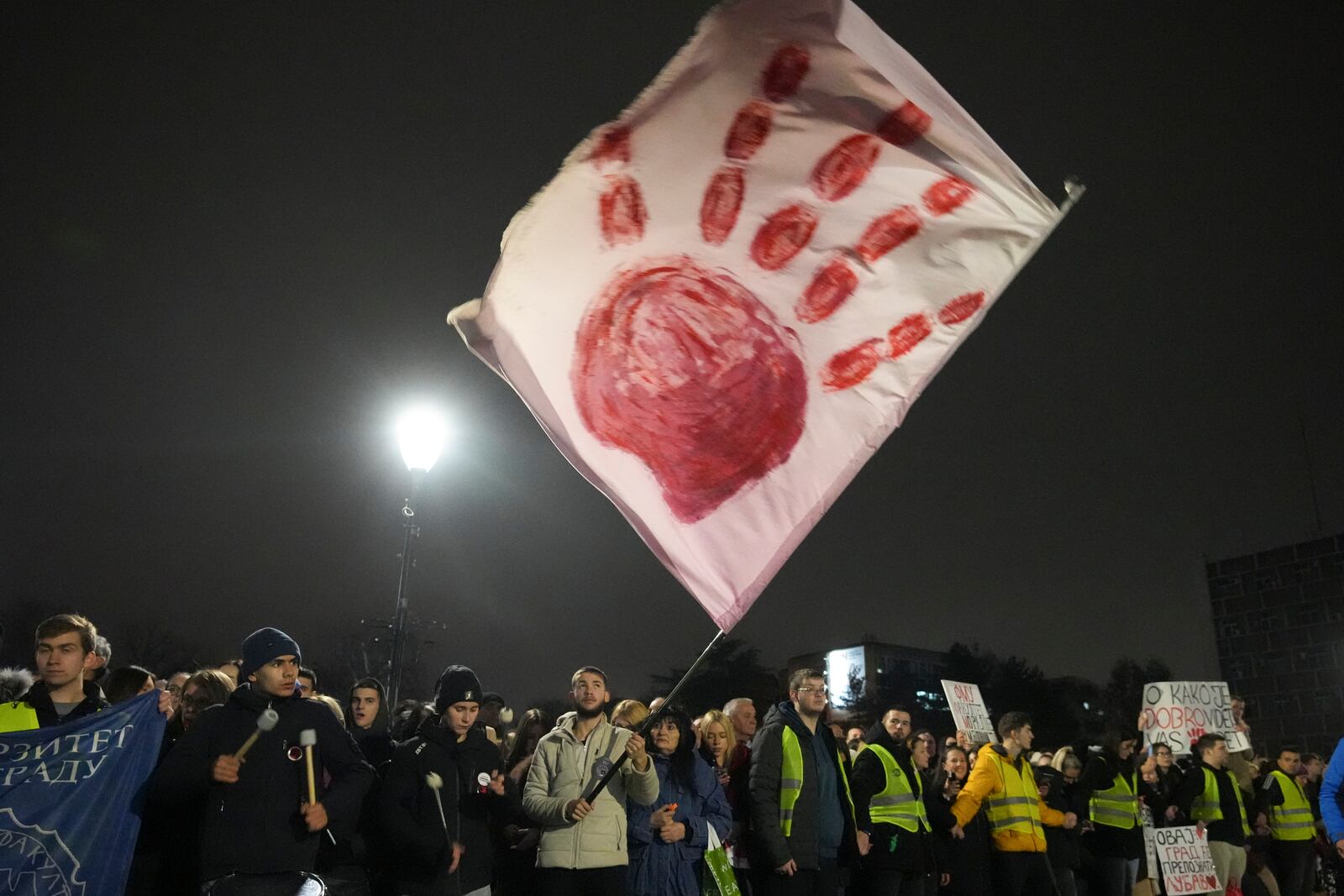 Residents welcome students in the Serbian industrial town of Kragujevac, who have arrived to protest the deaths of 15 people killed in the November collapse of a train station canopy, Friday, Feb. 14, 2025. (AP Photo/Darko Vojinovic)