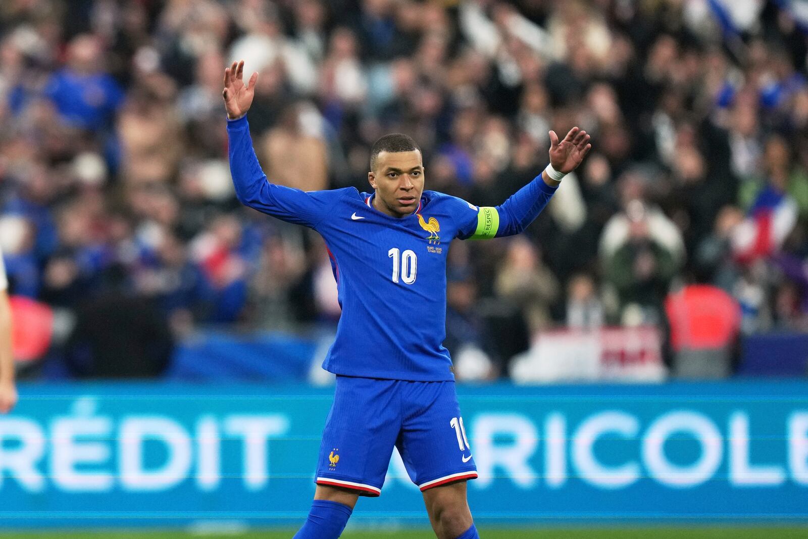 France's Kylian Mbappe celebrates after his teammate Michael Olise scoring their side's opening goal during the UEFA Nations League quarterfinal second leg soccer match between France and Croatia, at the Stade de France in Saint-Denis, outside Paris, Sunday, March 23, 2025. (AP Photo/Thibault Camus)