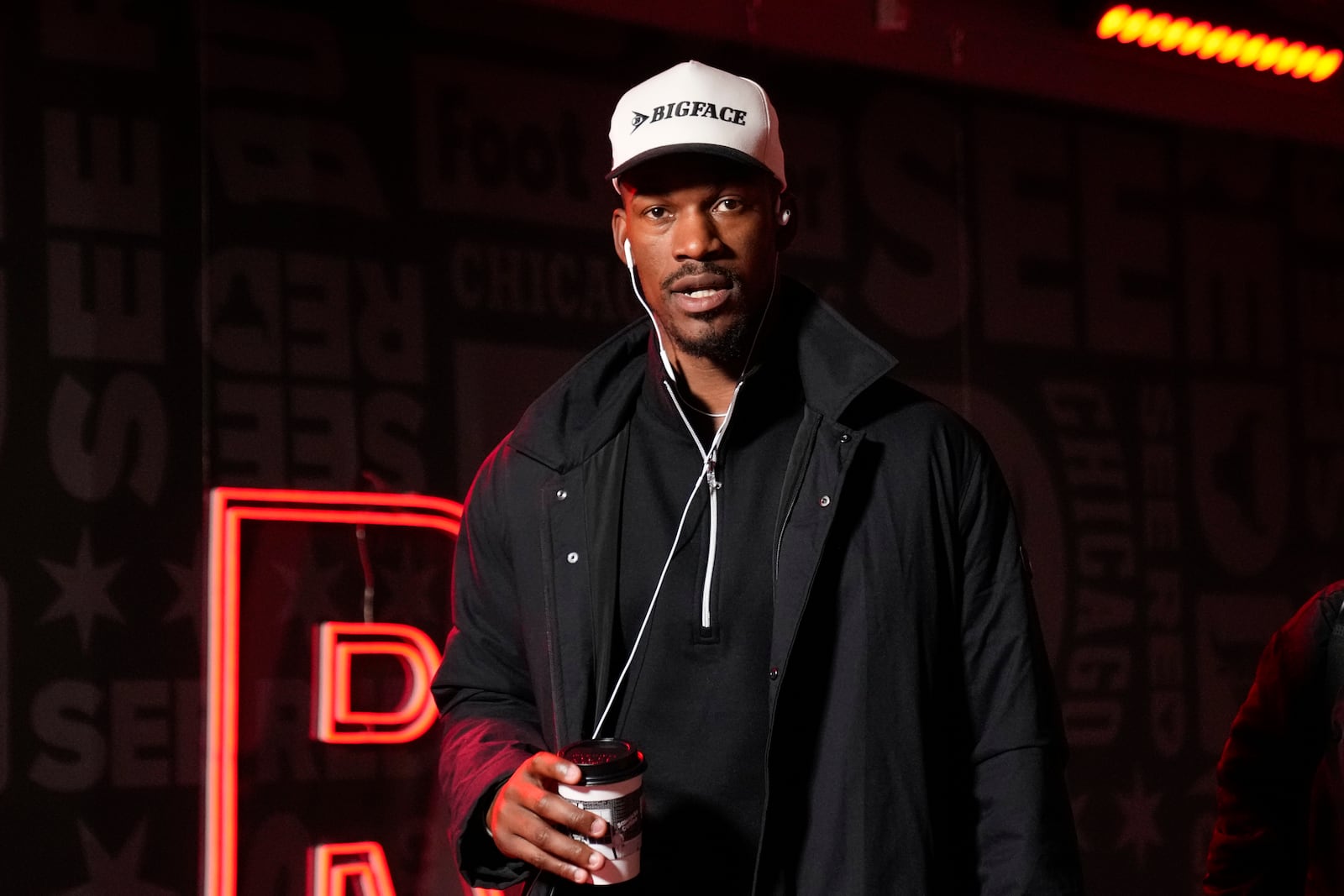 Golden State Warriors forward Jimmy Butler, left, arrives before an NBA basketball game against the Chicago Bulls, Saturday, Feb. 8, 2025, in Chicago. (AP Photo/Erin Hooley)