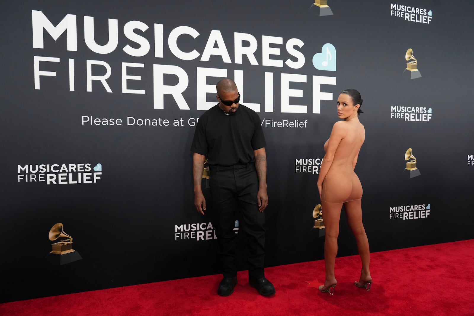 Kanye West, left, and Bianca Censori arrive at the 67th annual Grammy Awards on Sunday, Feb. 2, 2025, in Los Angeles. (Photo by Jordan Strauss/Invision/AP)