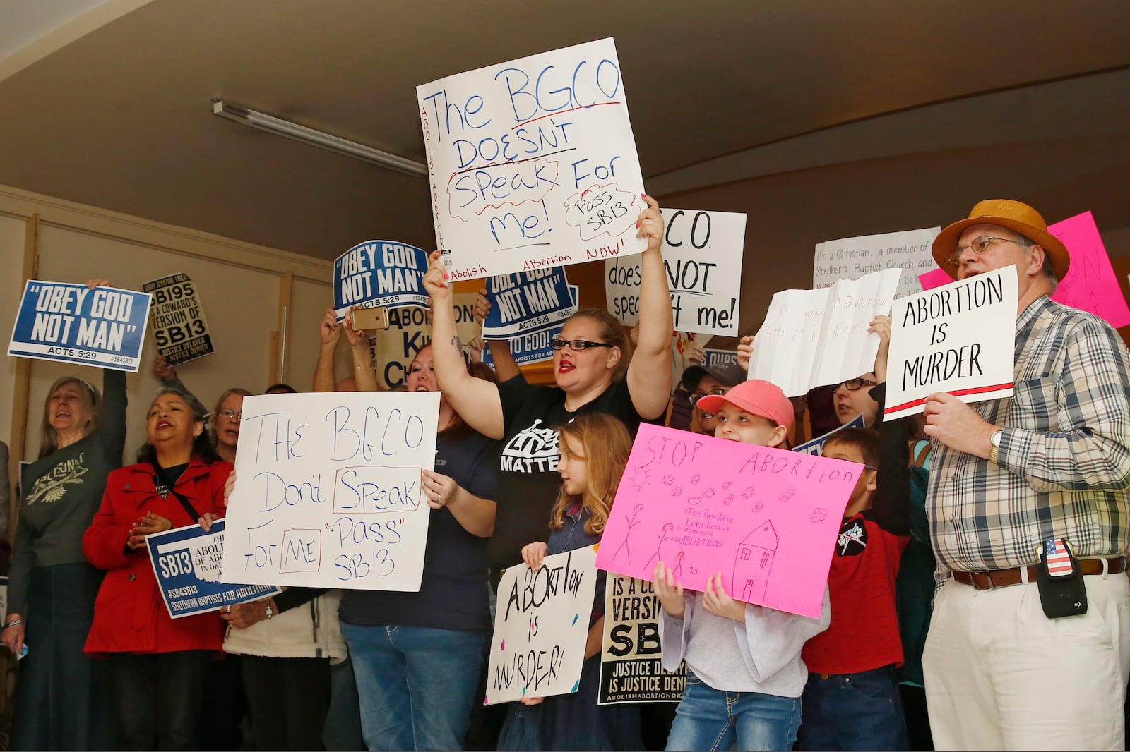 FILE - In this Monday, Feb. 25, 2019 photo, abortion opponents cheer for a speaker at a rally at the state Capitol in Oklahoma City. (AP Photo/Sue Ogrocki, File)