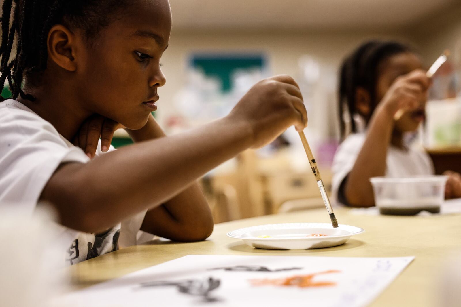 Jayden Johnson, 4, paints a picture from a book on Tuesday, Aug. 31, 2021, during classtime at the Marilyn E. Thomas Center operated by the Miami Valley Child Development Centers on Shiloh Springs Road in Trotwood.  JIM NOELKER/STAFF