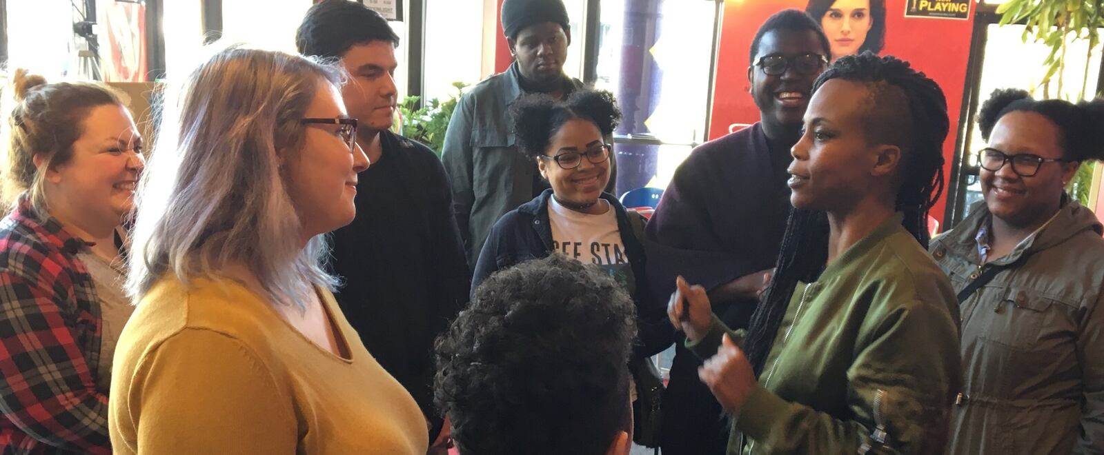 Hannah Beachler (second from right) talks with Wright State students in the lobby of The Neon movie theater in downtown Dayton. CONTRIBUTED