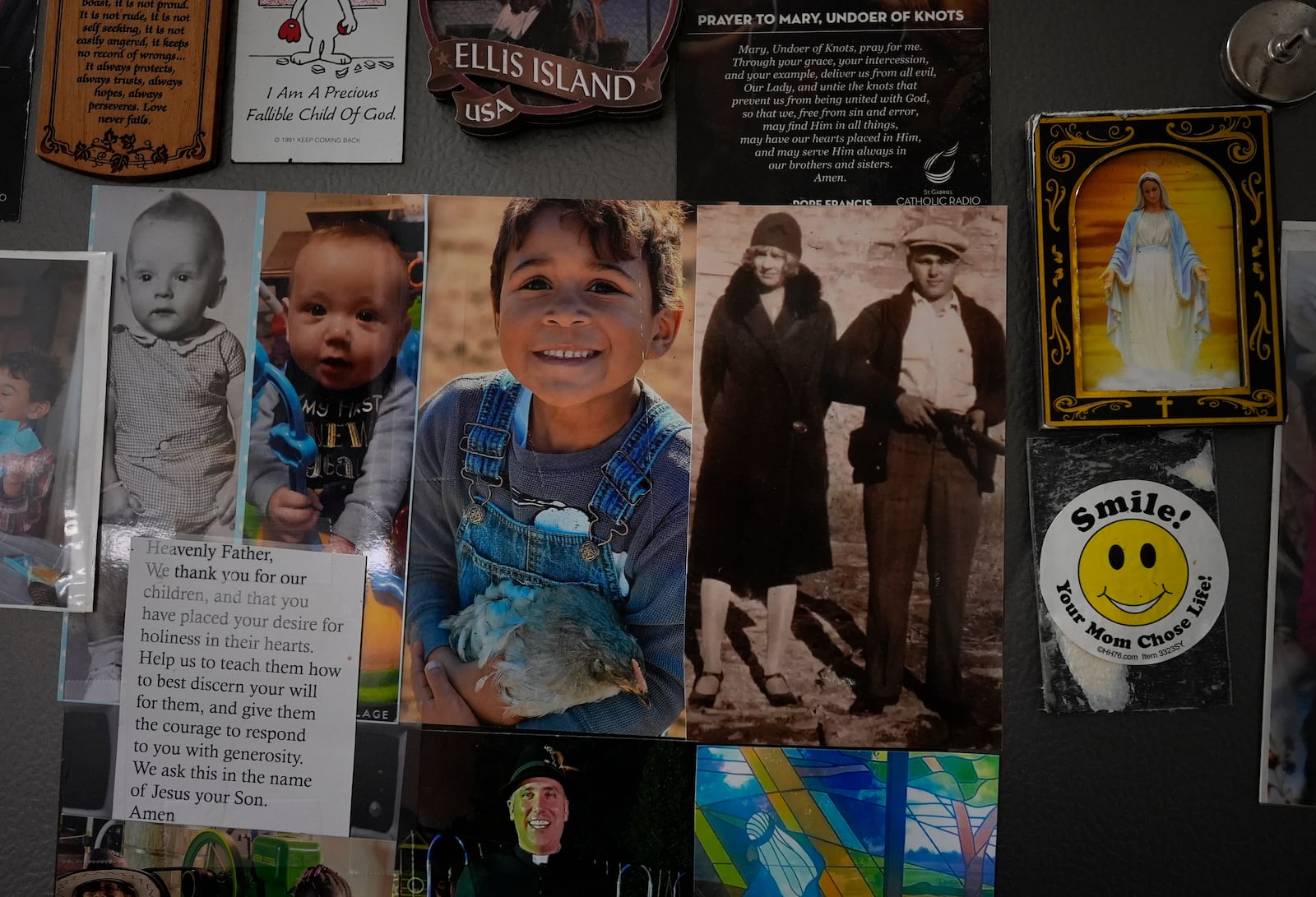 The refrigerator is decorated with family photos, prayers, and drawings in the Young's Sunbury, Ohio, kitchen on Tuesday, Nov. 12, 2024. (AP Photo/Carolyn Kaster)