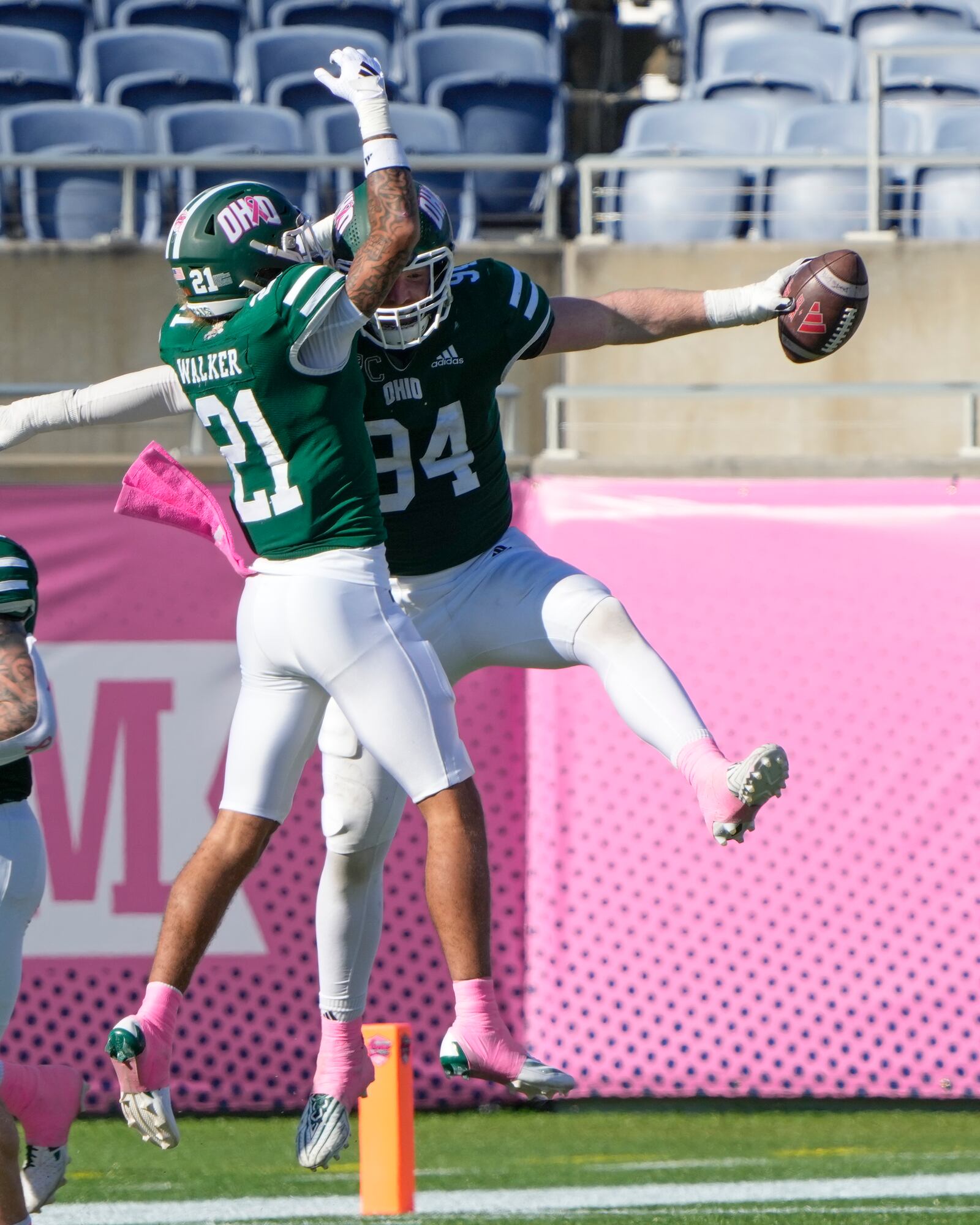 Ohio defensive end Bradley Weaver (94) celebrates his fumble recovery against Jacksonville State with teammate safety DJ Walker (21)during the second half of the Cure Bowl NCAA college football game, Friday, Dec. 20, 2024, in Orlando, Fla. (AP Photo/John Raoux)