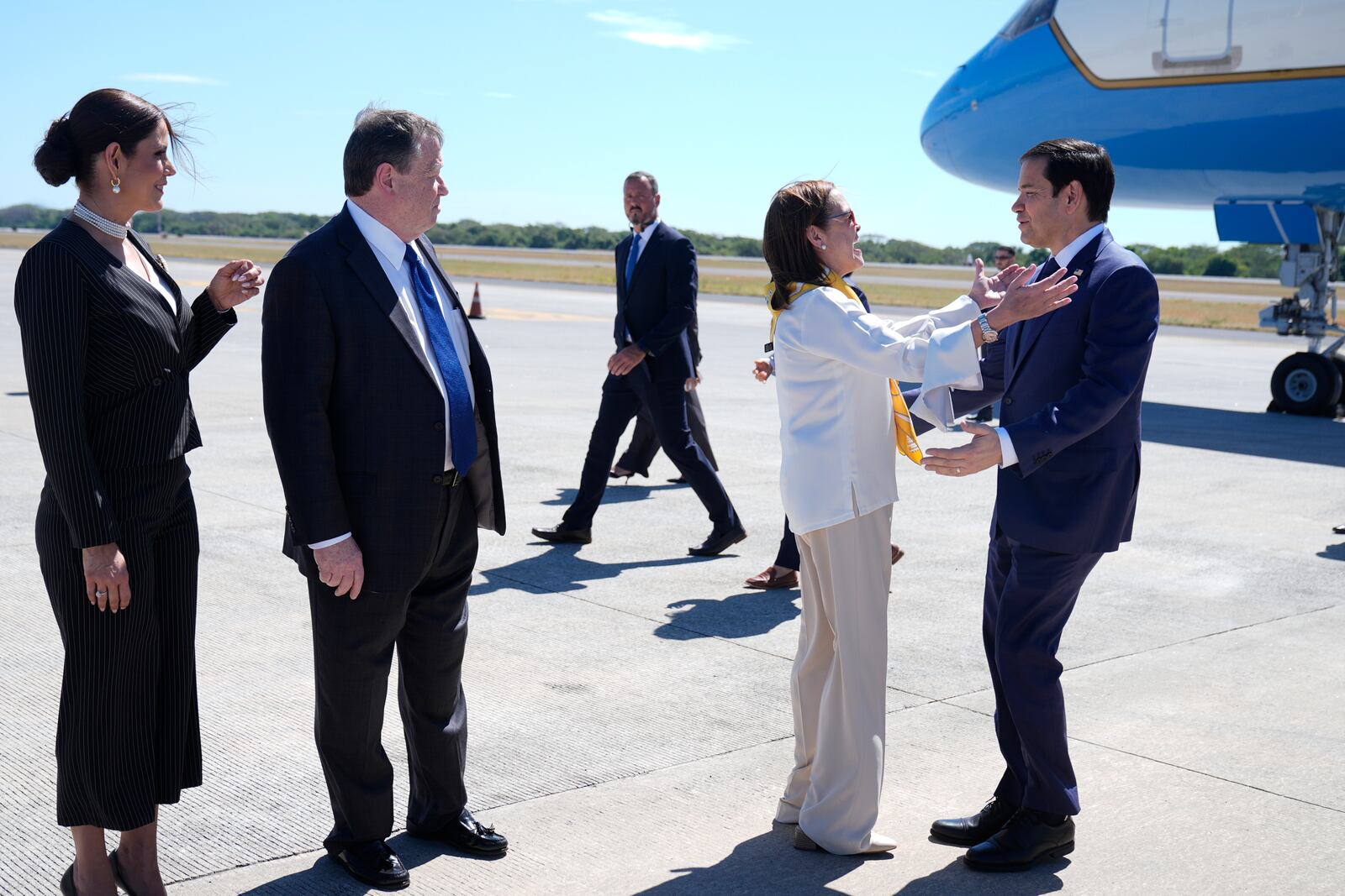 El Salvador's Foreign Minister Alexandra Hill Tinoco welcomes U.S. Secretary of State Marco Rubio, right, upon his arrival to the international airport in San Luis Talpa, El Salvador, Monday, Feb. 3, 2025. Also photographed are U.S. Ambassador to El Salvador William H. Duncan, second from left, and El Salvador Ambassador to the United States Milena Mayorga. (AP Photo/Mark Schiefelbein, Pool)