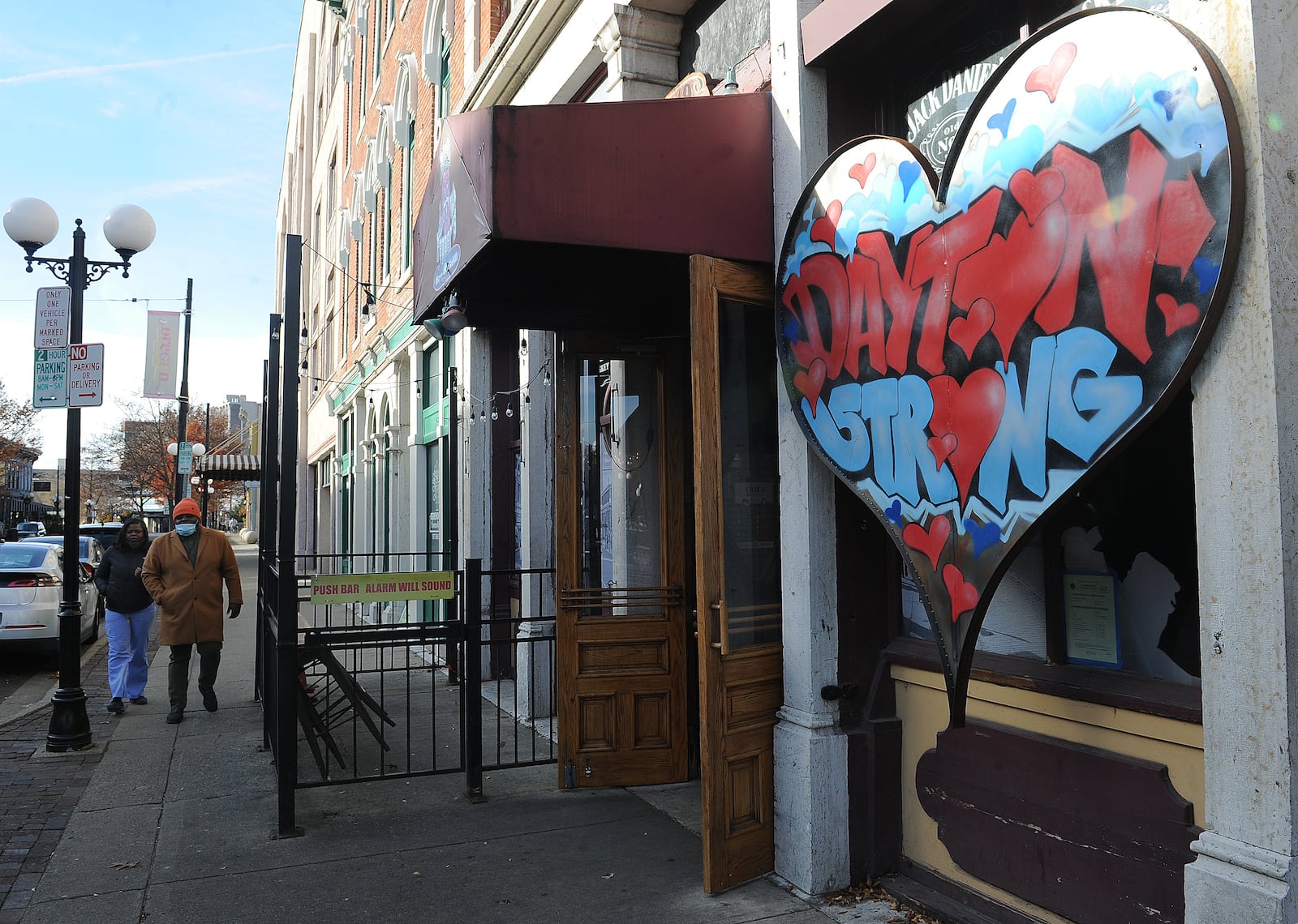 The FBI and Dayton police announced Monday, Nov. 29, 2021, they closed the 26-month investigation into the Aug. 4, 2019, Oregon District mass shooting. A Dayton Strong sign still stands in front of Ned Peppers Bar, near where the fatal shooting took place. MARSHALL GORBY\STAFF