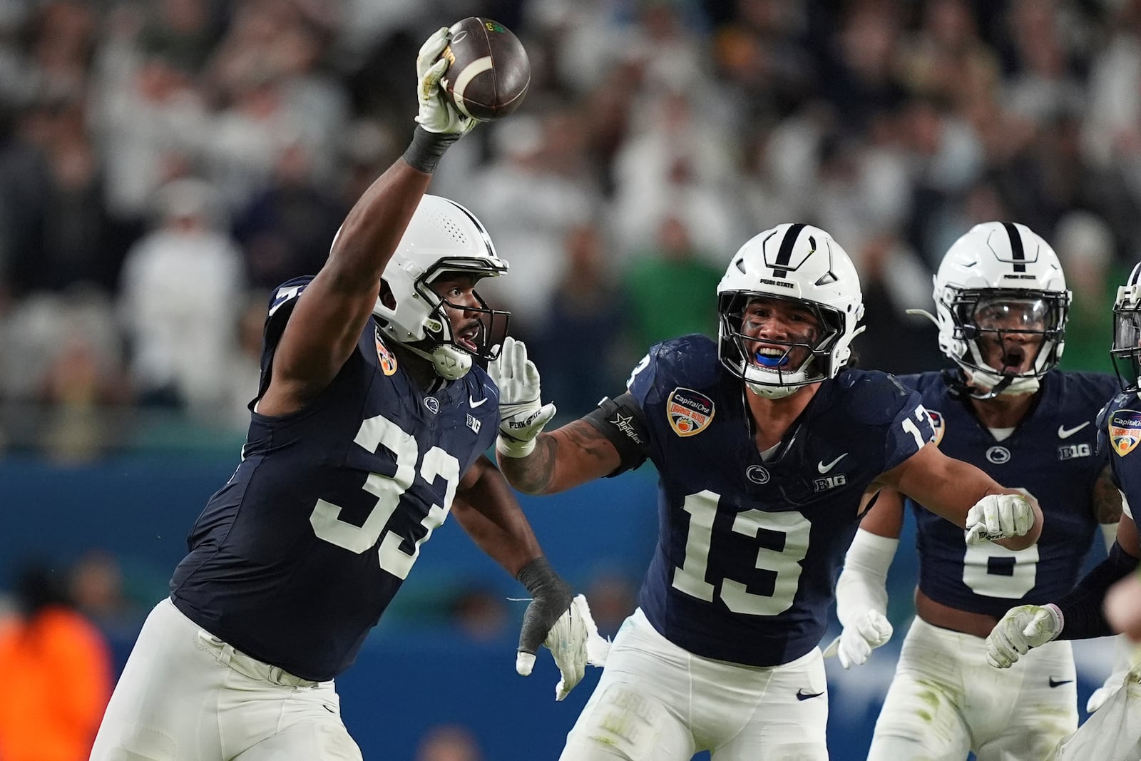 Penn State defensive end Dani Dennis-Sutton (33) celebrates after intercepting a pass during the second half of the Orange Bowl College Football Playoff semifinal game against Notre Dame, Thursday, Jan. 9, 2025, in Miami Gardens, Fla. (AP Photo/Rebecca Blackwell)