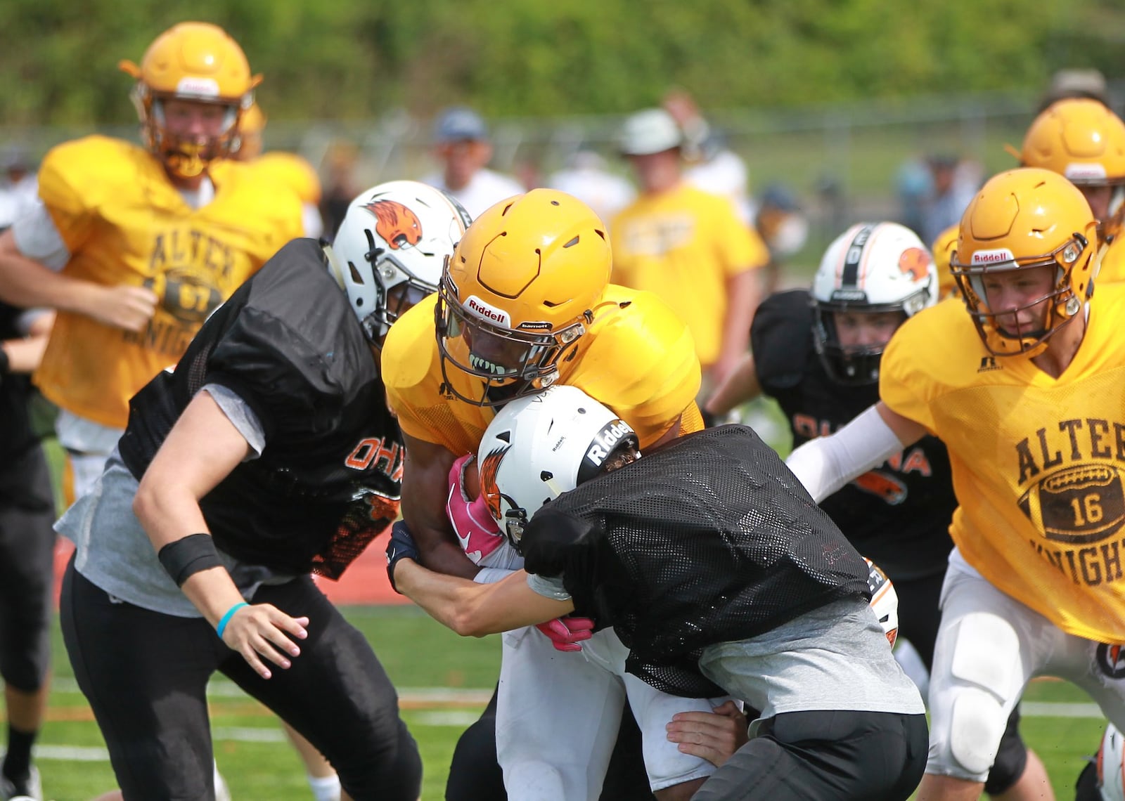 Alter High School sophomore C.J. Hicks makes a short gain during a scrimmage at Beavercreek on Saturday, Aug. 17, 2019. MARC PENDLETON / STAFF