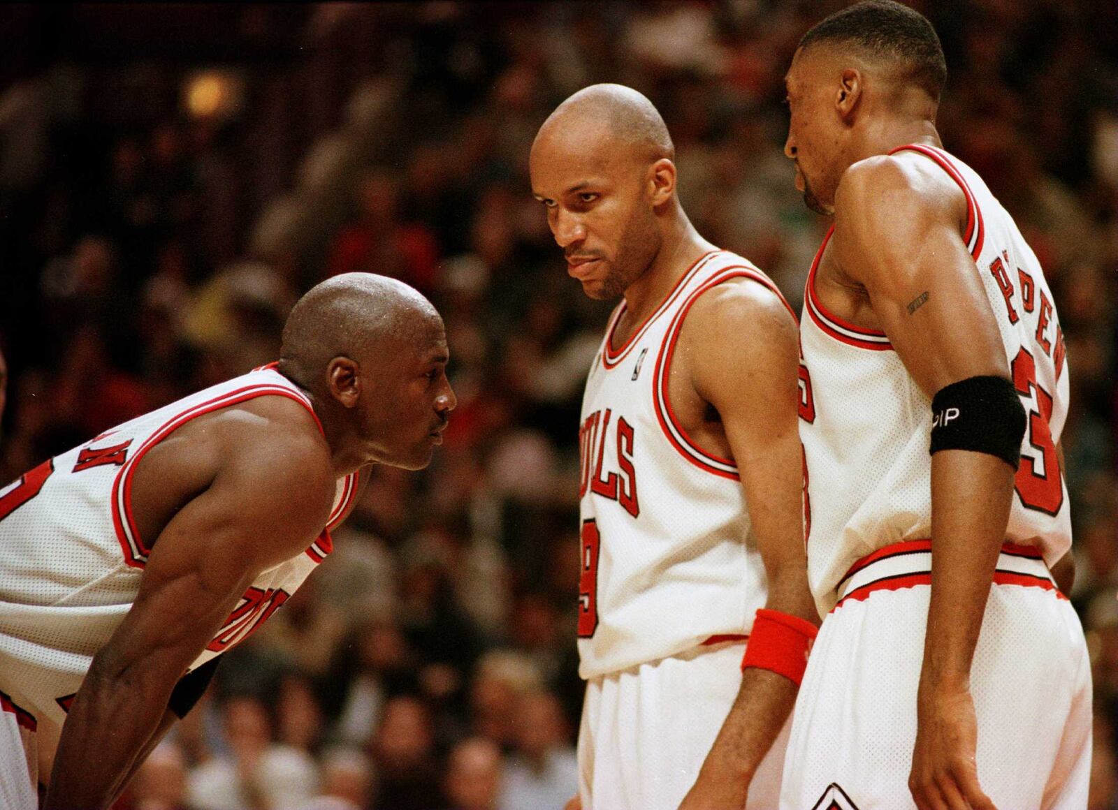 7 Jun 1996:  Michael Jordan of the  Chicago Bull, left, discusses strategy with teammates Ron Harper, center, and Scottie Pippen during a time-out on the court during the fourth quarter of game two in the NBA Finals at the United Center in Chicago, Illino