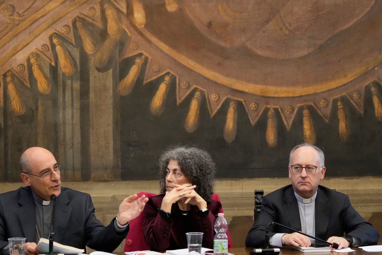 From left, Cardinal Victor Fernandez, Poet Maria Grazia Calandrone and Jesuit Father Antonio Spadaro meet the journalists during the presentation of a book by Pope Francis titled "Viva la Poesia" (long live poetry) in Rome, Friday, March 21, 2025. (AP Photo/Gregorio Borgia)