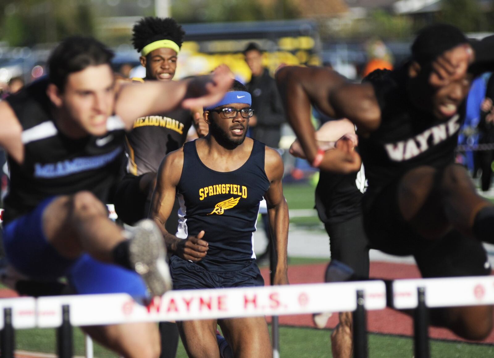 Springfield senior Austin Tyree (middle) was third in 110 high hurdles and won the 300 hurdles during the Wayne Inv. on Friday, April 26, 2019. MARC PENDLETON / STAFF