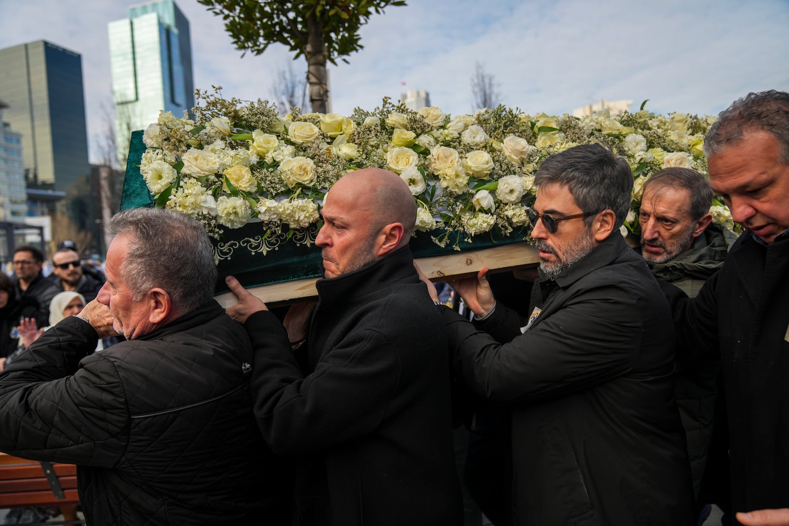 Relatives carry a coffin during the funeral of three members of the Inal family, who died in a fire that broke out at the Kartalkaya ski resort, at the Barbaros Hayreddin Pasa mosque in Istanbul, Turkey, Friday, Jan. 24, 2025. (AP Photo/Francisco Seco)