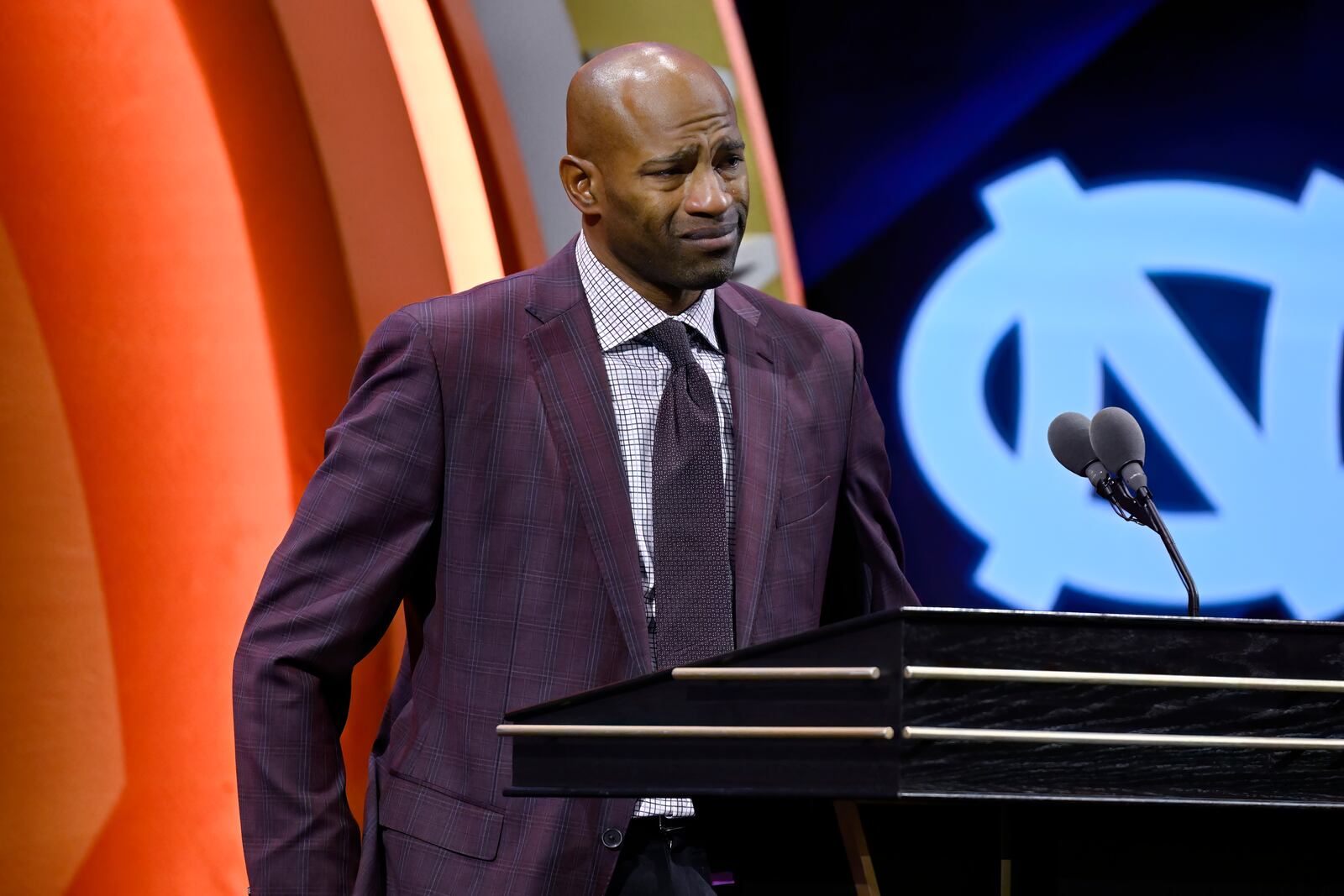 Vince Carter reacts while talking about his mother during his enshrinement in the Basketball Hall of Fame, Sunday Oct. 13, 2024, in Springfield, Mass. (AP Photo/Jessica Hill)