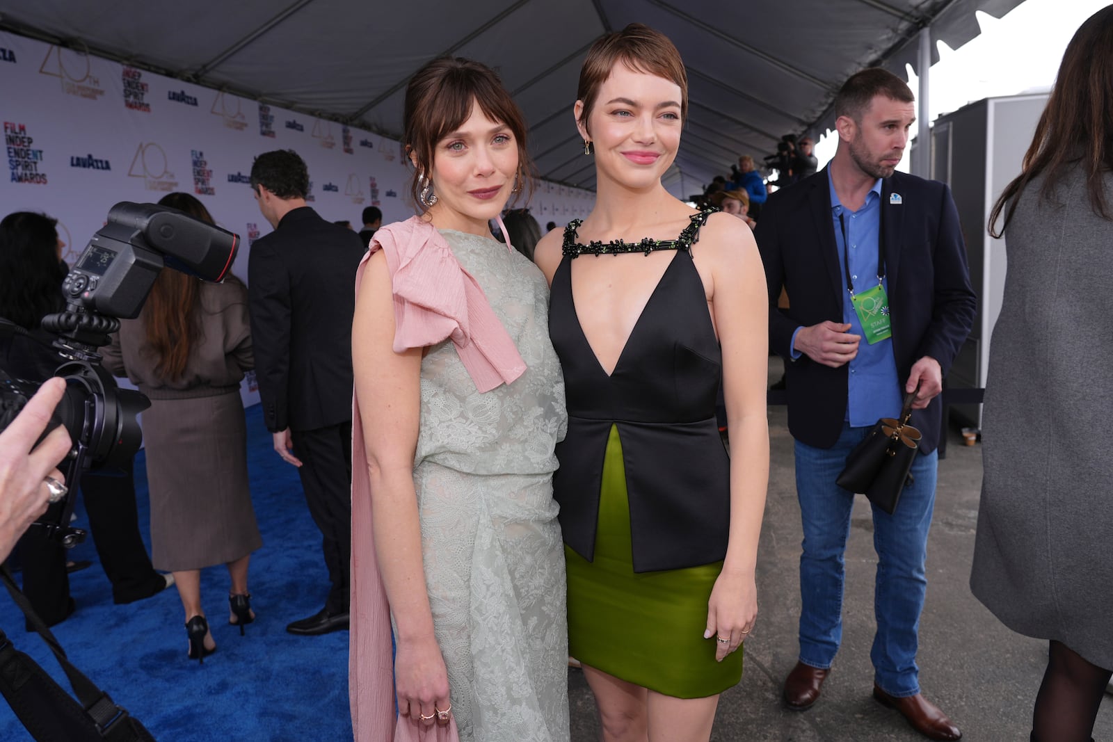 Elizabeth Olsen, left, and Emma Stone arrive at the Film Independent Spirit Awards on Saturday, Feb. 22, 2025, in Santa Monica, Calif. (AP Photo/Chris Pizzello)