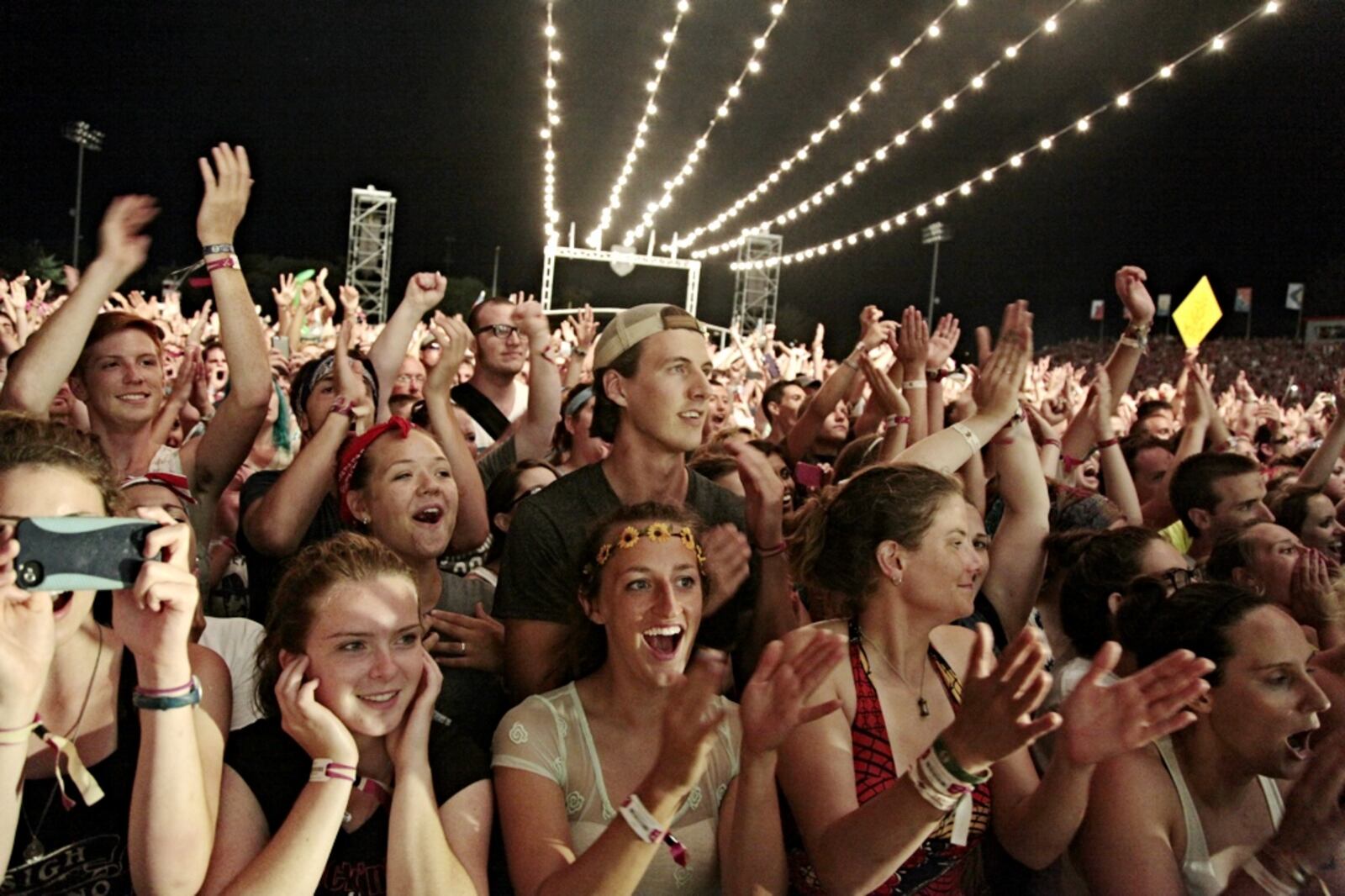 Headliners the Mumford and Sons Band plays to a full house at Troy Memorial Field Saturday night. JIM NOELKER / STAFF