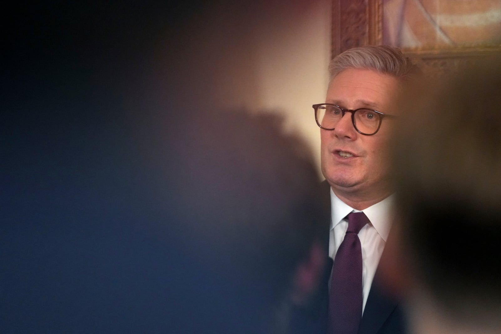 Britain's Prime Minster Keir Starmer speaks to guests as he holds a reception on the third anniversary of Russia's invasion of Ukraine in London, Monday, Feb. 24, 2025. (AP Photo/Frank Augstein, Pool)