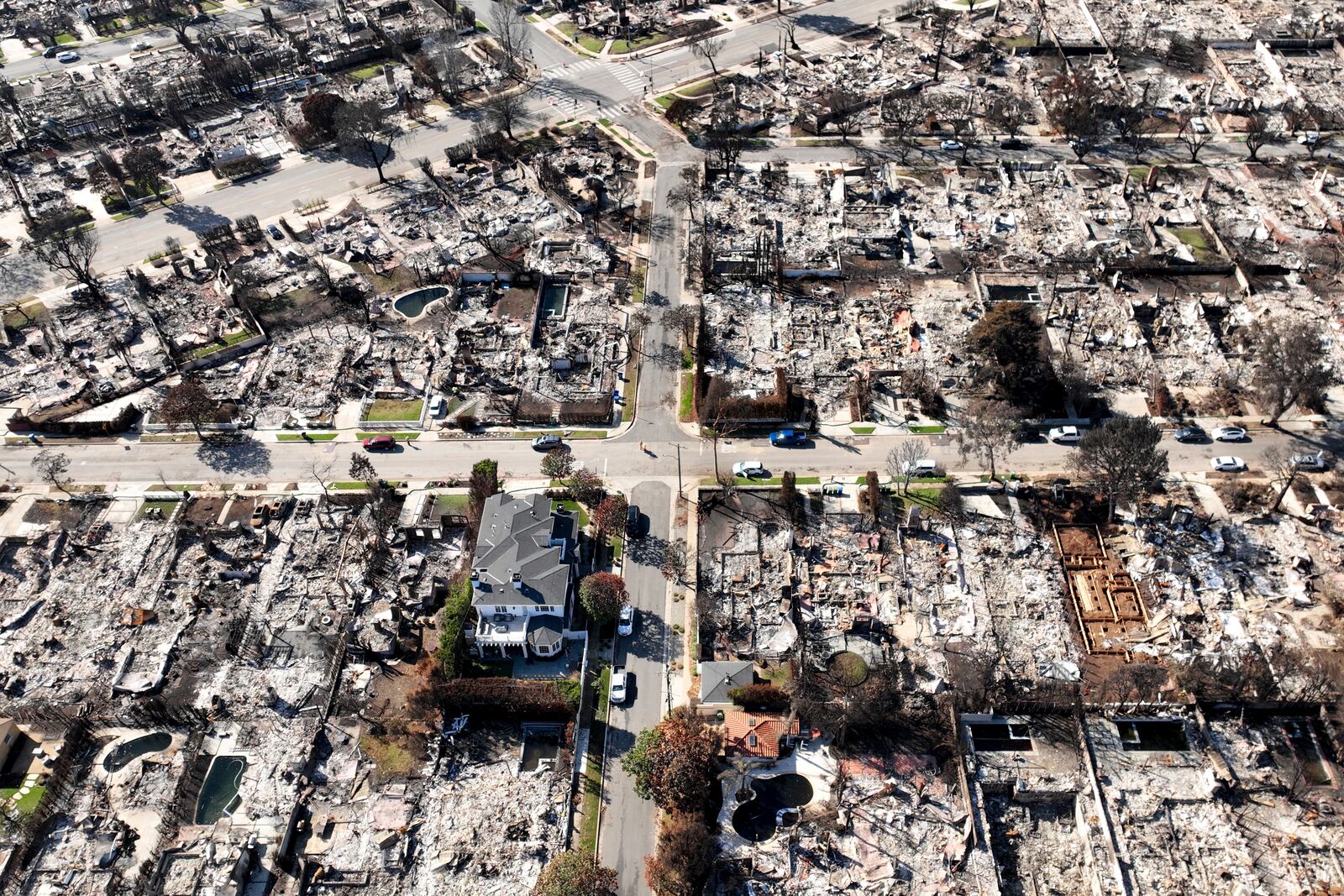 A lone residence is left standing amid the devastation from the Palisades Fire, in an aerial view, in the Pacific Palisades neighborhood of Los Angeles, Monday, Jan. 27, 2025. (AP Photo/Jae C. Hong)