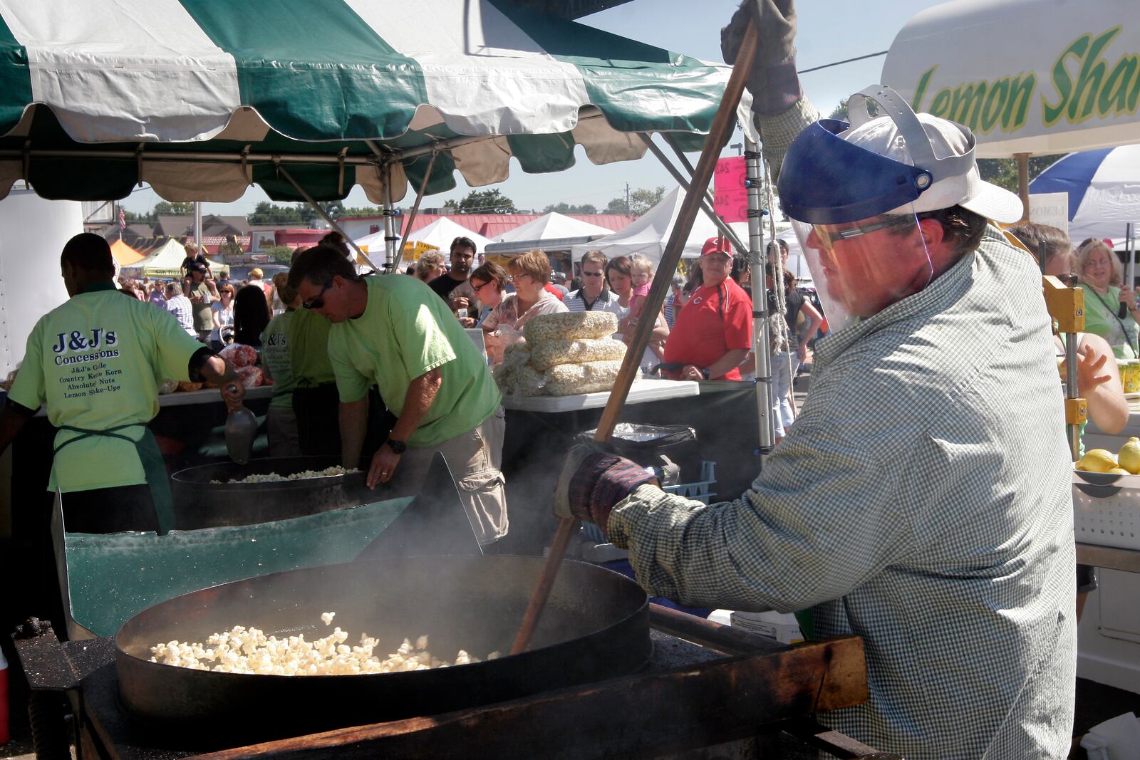 Scott Jenkins stirs up a batch of Kettle Corn for J & J's Concessions at the Beavercreek Popcorn Festival Sunday, Sept. 13.