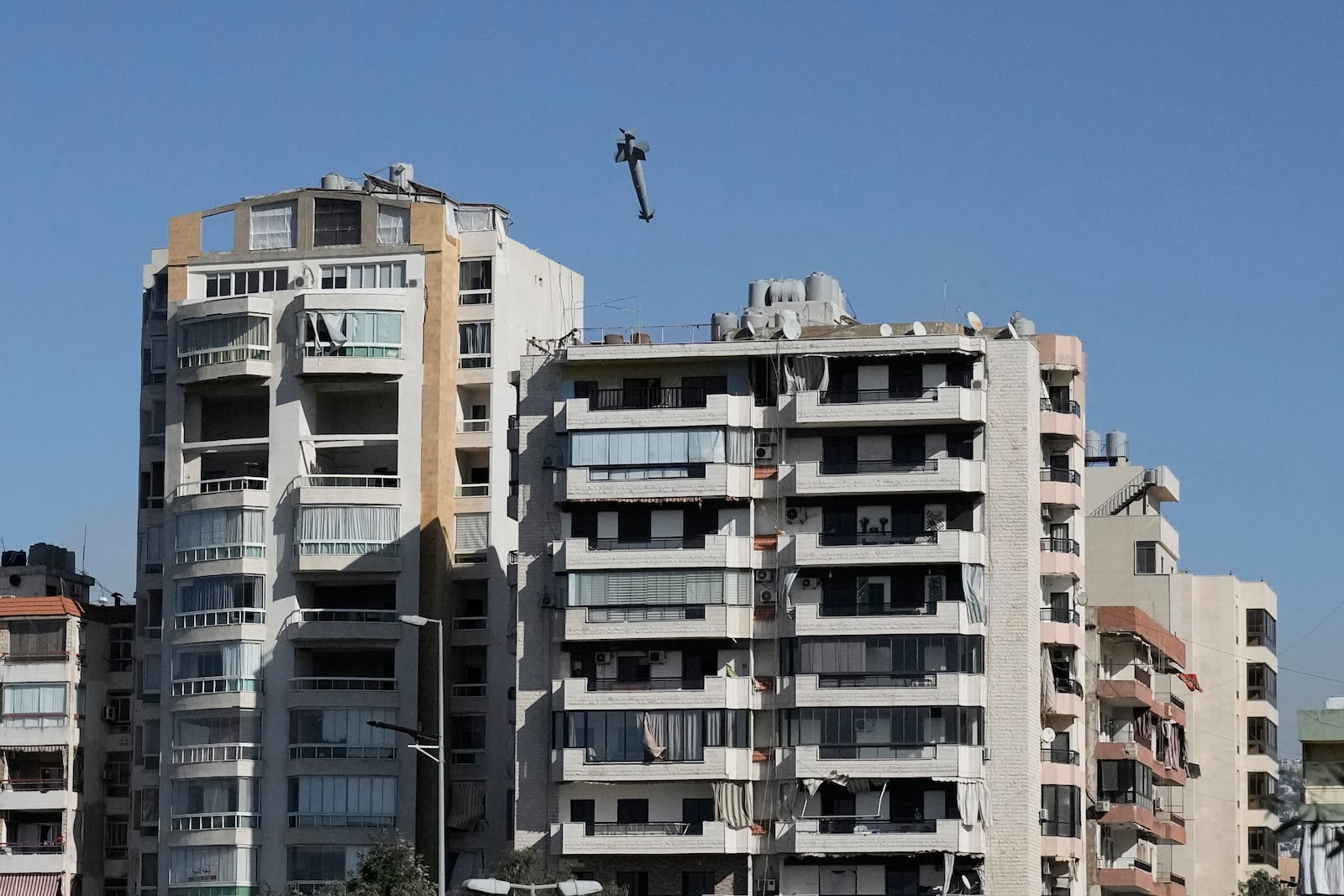 A missile launched from an Israeli jet hits a building in Ghobeiri, Beirut, Lebanon, Tuesday, Oct. 22, 2024. (AP Photo/Bilal Hussein)