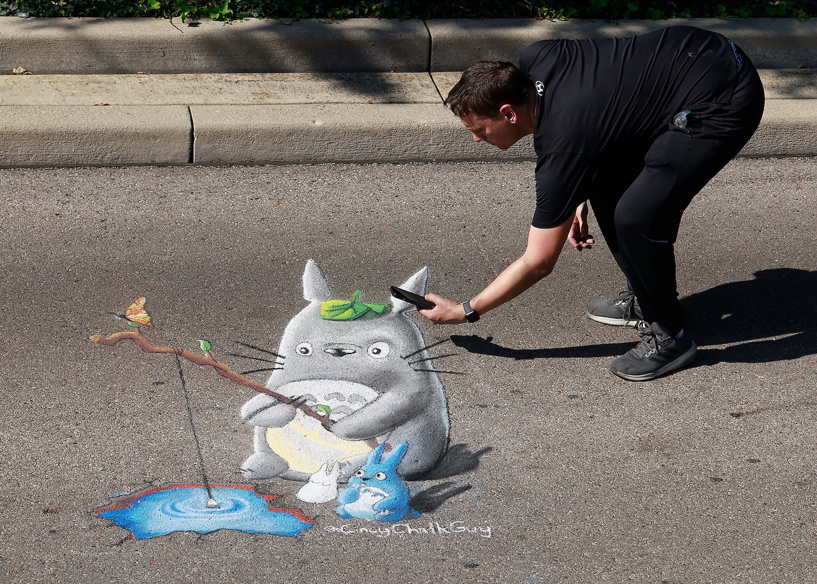 Dozens of amateur and professional artists from around the area showed off their skill on the sidewalks and streets surrounding  National Roard Commons Park for ChalkFest Saturday, Oct. 5, 2024.. ChalkFest also featured live music, food trucks and creative activities for the kids. BILL LACKEY/STAFF