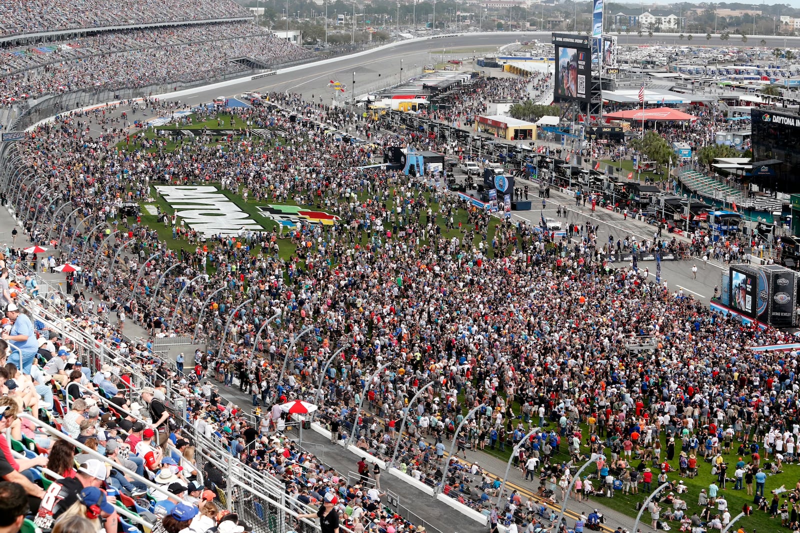 FILE - Fans fill the infield during activities before the NASCAR Daytona 500 auto race at Daytona International Speedway, Feb. 19, 2023, in Daytona Beach, Fla. (AP Photo/David Graham, File)