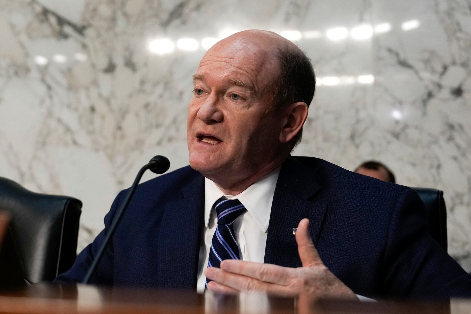 Sen. Chris Coons, D-Del., speaks at the Senate Judiciary Committee confirmation hearing for Pam Bondi, President-elect Donald Trump's choice to lead the Justice Department as attorney general, at the Capitol in Washington, Wednesday, Jan. 15, 2025. (AP Photo/Ben Curtis)