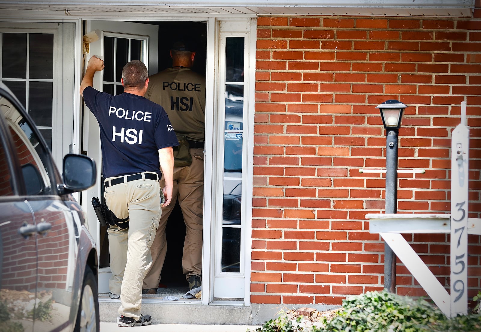 Homeland security, searching a home at 3759 Woodbury Dr., Friday, July 26, 2024. MARSHALL GORBY \STAFF