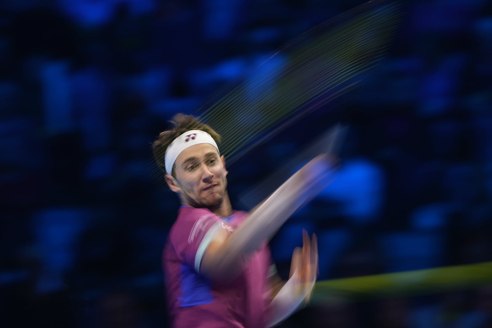 Norway's Casper Ruud returns the ball to Russia's Andrey Rublev during their singles tennis match of the ATP World Tour Finals at the Inalpi Arena, in Turin, Italy, Friday, Nov. 15, 2024. (AP Photo/Antonio Calanni)