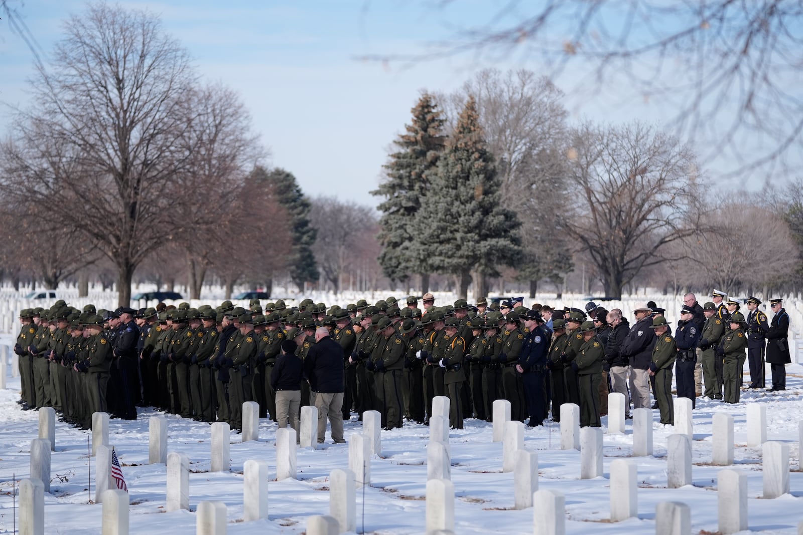 U.S. Border Patrol members attend the service for U.S. Border Patrol agent David Maland to be recognized with military honors before his burial at Fort Snelling National Cemetery in Minneapolis, on Saturday, Feb. 22, 2025. (AP Photo/Abbie Parr)