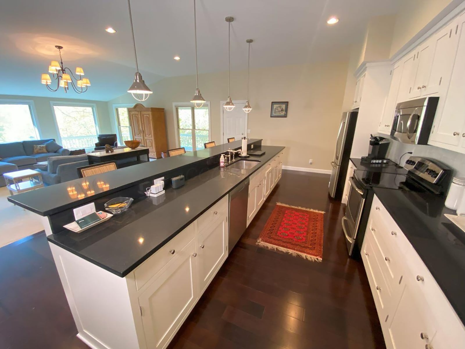 The remodeled kitchen is open to the great room and has an oversized breakfast bar.