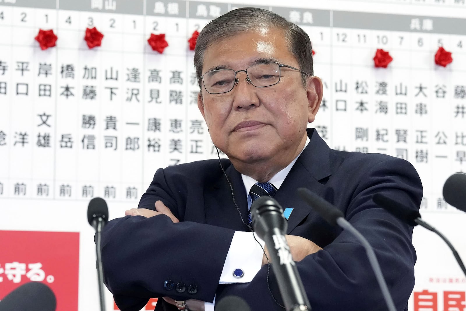 Japan's Prime Minister and president of the Liberal Democratic Party (LDP) Shigeru Ishiba pauses as he speaks to the media regarding the lower house election, at the LDP headquarters Sunday, Oct. 27, 2024, in Tokyo, (Kyodo News via AP)