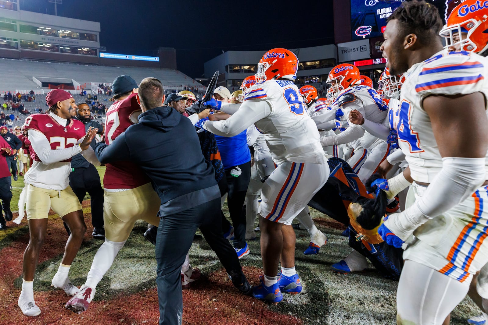 Florida State and Florida players scuffle at midfield after an NCAA college football game Saturday, Nov. 30, 2024, in Tallahassee, Fla. (AP Photo/Colin Hackley)