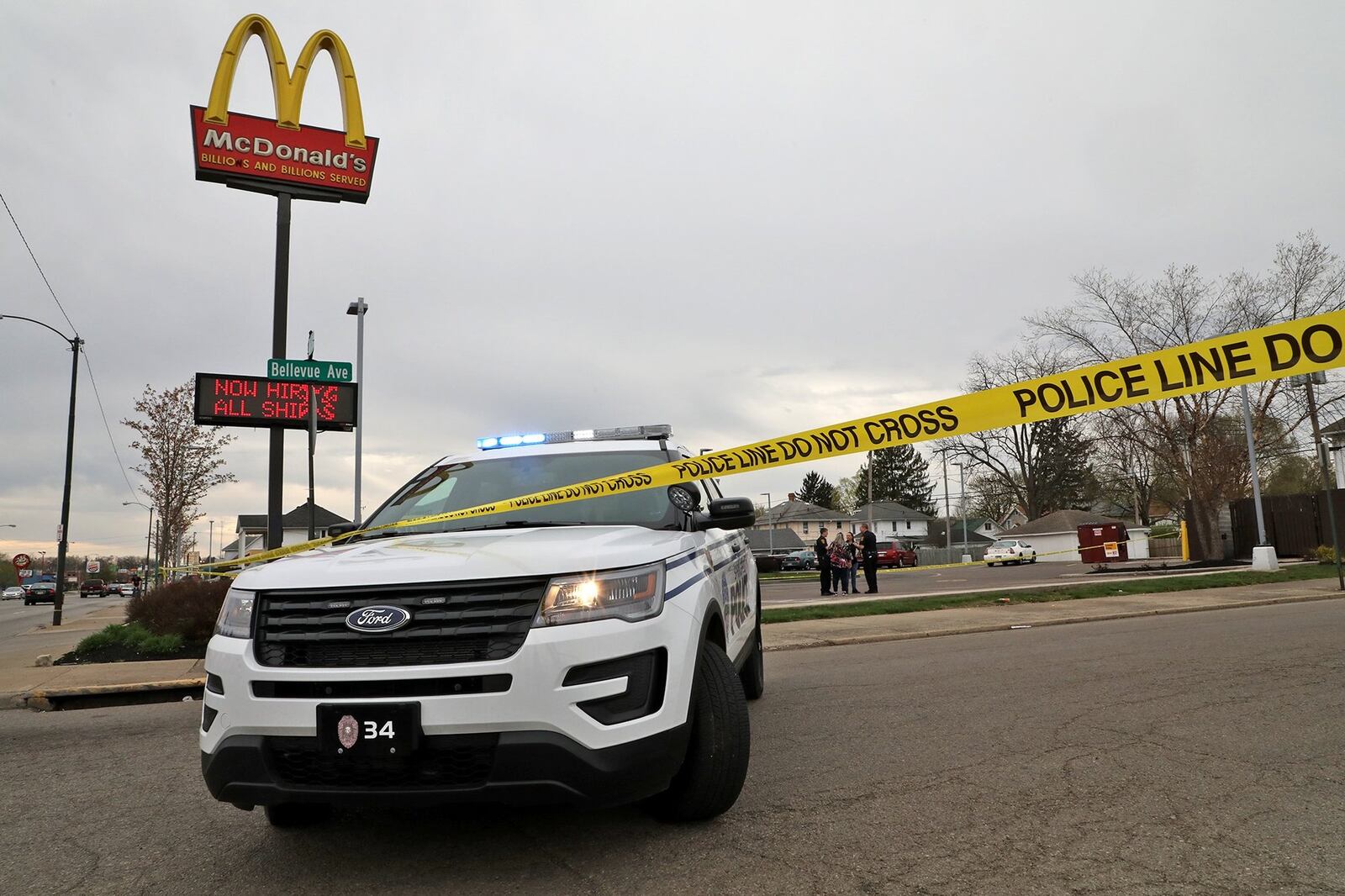 Springfield police investigate a shooting on Bellevue Avenue outside the McDonald’s on East Main Street Wednesday evening. BILL LACKEY/STAFF