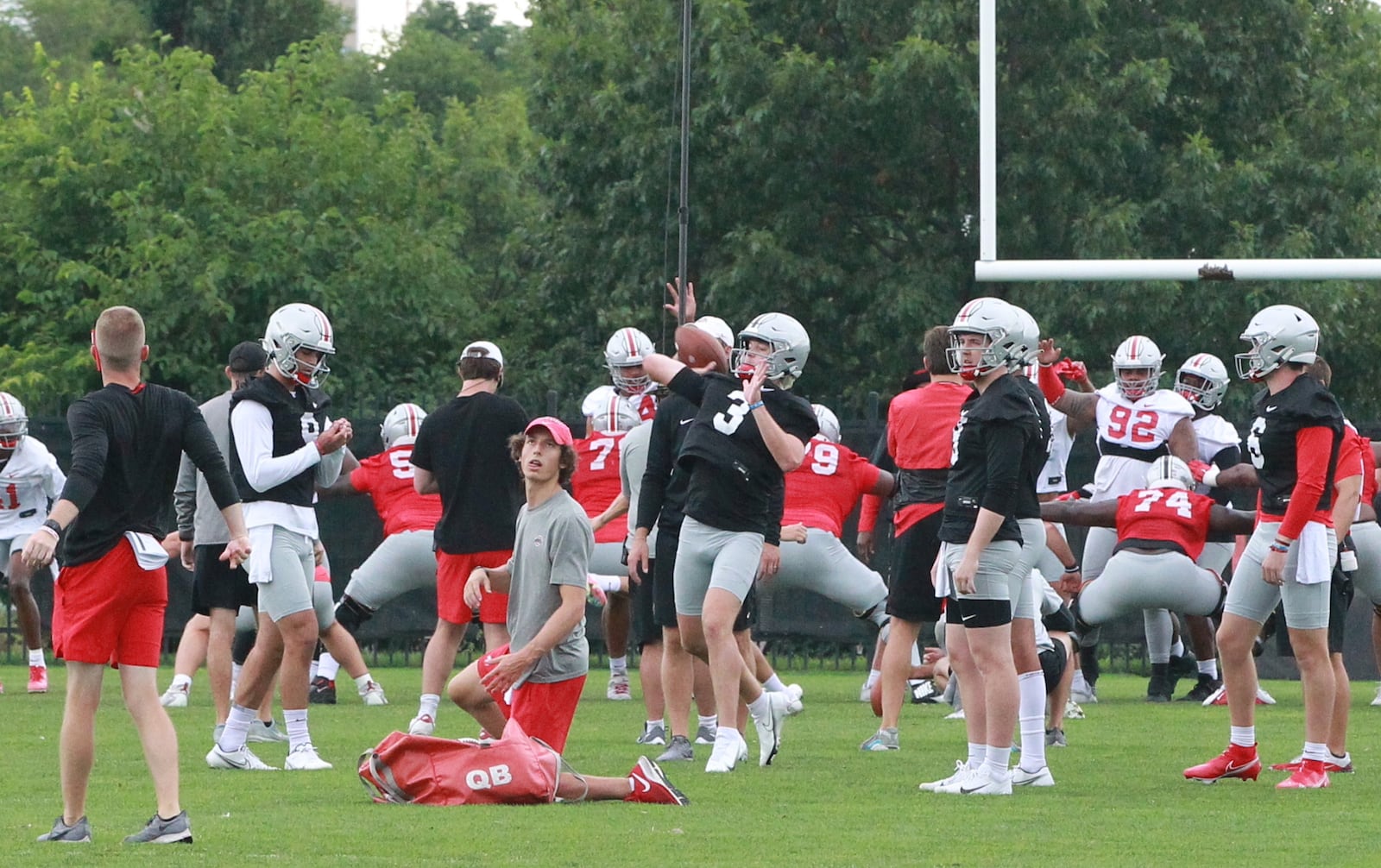 Quinn Ewers throws a pass at Ohio State Buckeyes football practice.