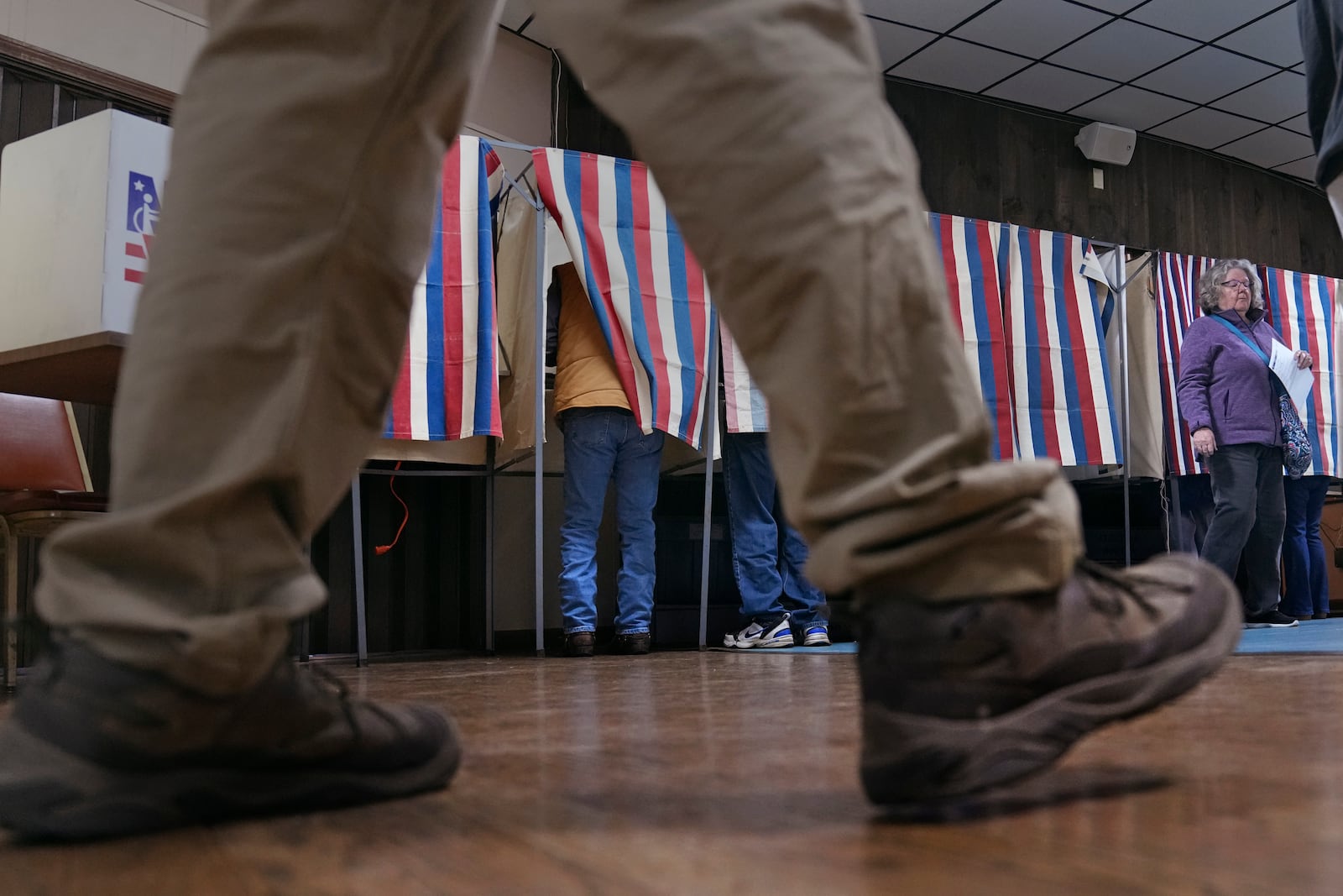 People cast their ballots at a polling place at VFW Post 2520, on Election Day, Tuesday, Nov. 5, 2024, in Berlin, N.H. (AP Photo/Charles Krupa)