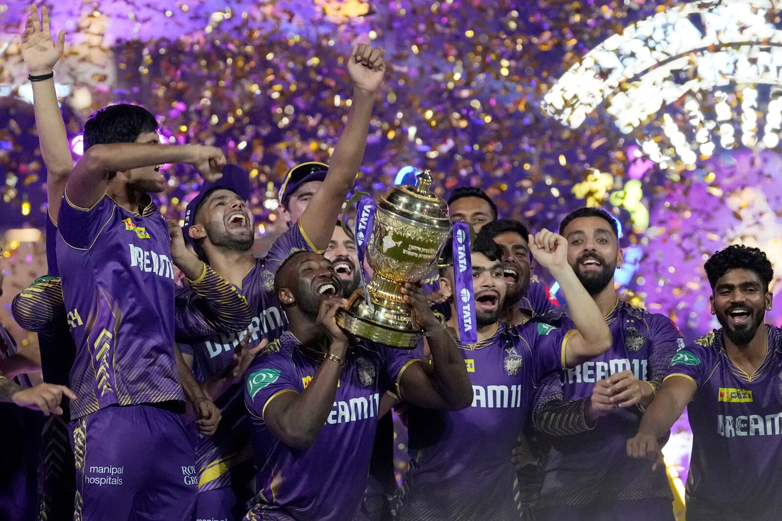 FILE - Kolkata Knight Riders players celebrate with the trophy after defeating Sunrisers Hyderabad during the Indian Premier League cricket final match in Chennai, India, Monday, May 27, 2024.(AP Photo/Mahesh Kumar A., File)