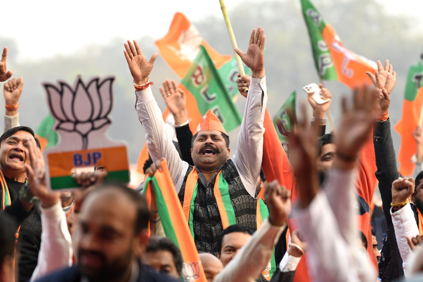 Supporters of Bharatiya Janata party shout slogans during Delhi state election campaign rally in New Delhi, India, Friday, Jan. 31, 2025. (AP Photo)