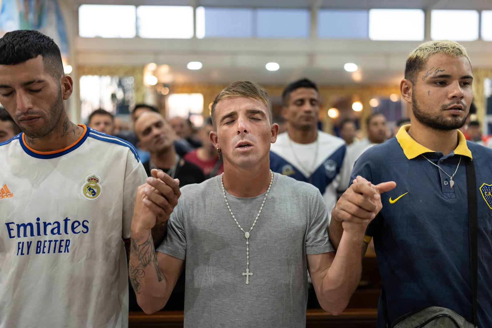 Faithful pray for Pope Francis' health during a Mass in Buenos Aires, Argentina, Tuesday, Feb. 18, 2025. (AP Photo/Rodrigo Abd)